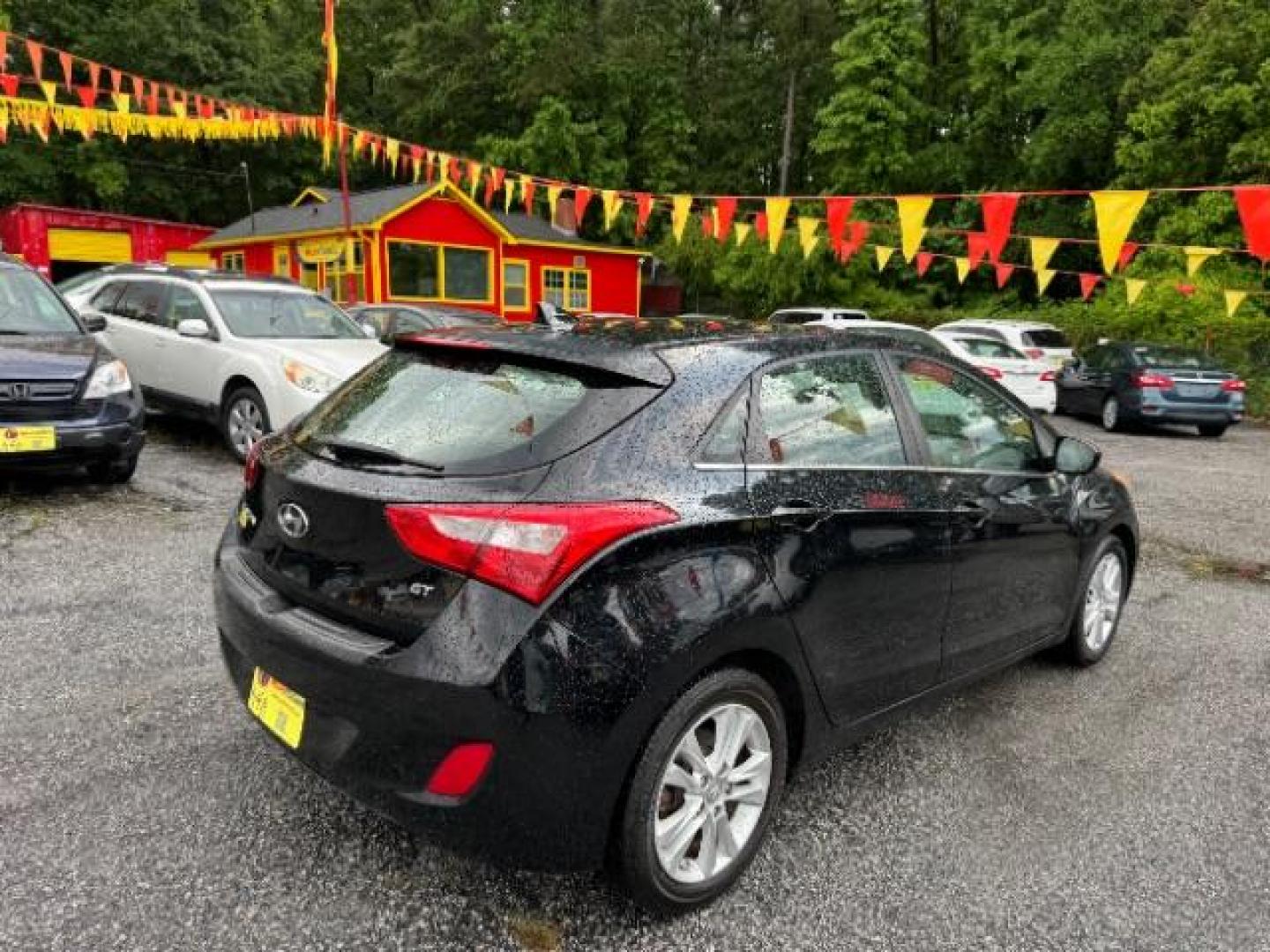 2013 Black Hyundai Elantra GT A/T (KMHD35LE3DU) with an 1.8L L4 16V DOHC engine, 6-Speed Automatic transmission, located at 1806 Veterans Memorial Hwy SW, Austell, GA, 30168, (770) 944-9558, 33.817959, -84.606987 - Photo#22