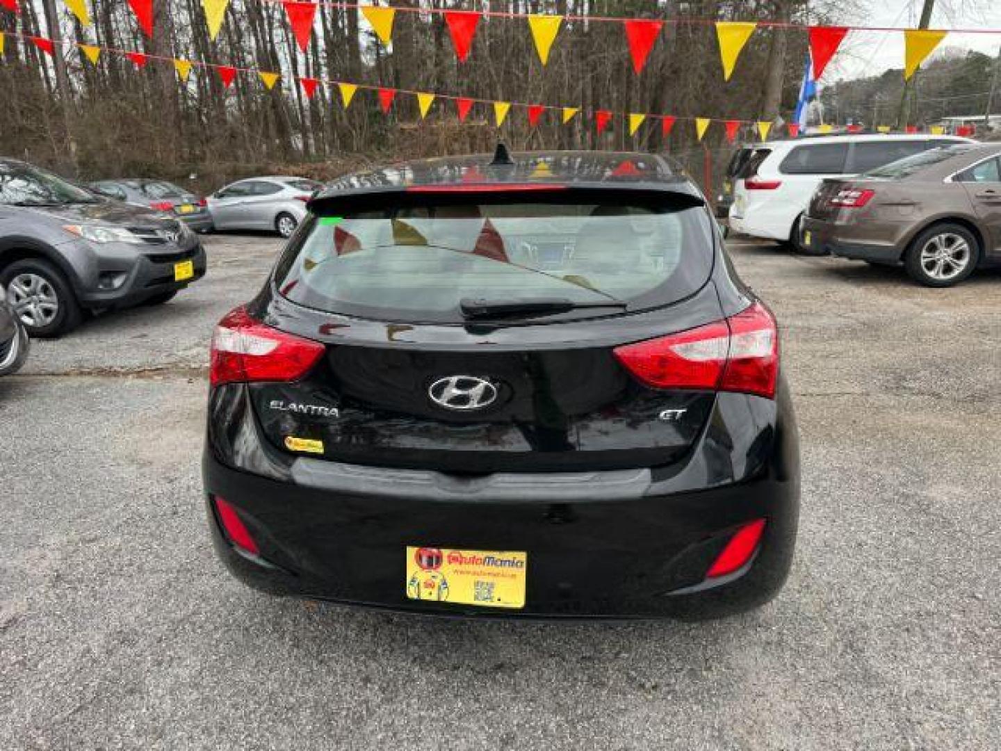 2013 Black Hyundai Elantra GT A/T (KMHD35LE3DU) with an 1.8L L4 16V DOHC engine, 6-Speed Automatic transmission, located at 1806 Veterans Memorial Hwy SW, Austell, GA, 30168, (770) 944-9558, 33.817959, -84.606987 - Photo#4