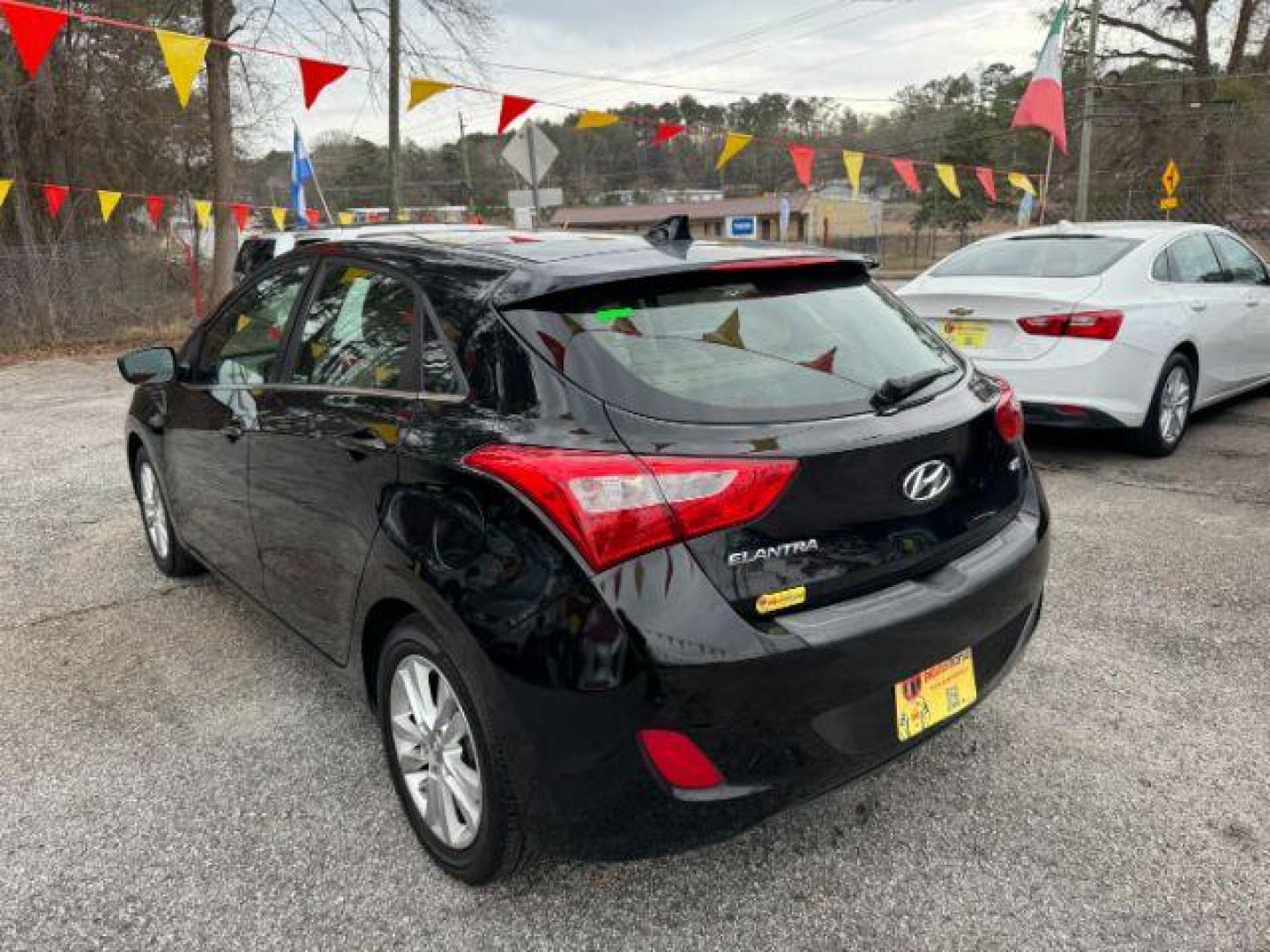 2013 Black Hyundai Elantra GT A/T (KMHD35LE3DU) with an 1.8L L4 16V DOHC engine, 6-Speed Automatic transmission, located at 1806 Veterans Memorial Hwy SW, Austell, GA, 30168, (770) 944-9558, 33.817959, -84.606987 - Photo#5