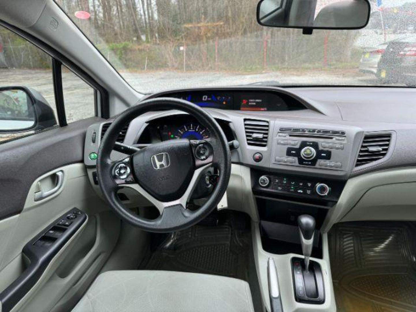 2012 Silver Honda Civic LX Sedan 5-Speed AT (2HGFB2F55CH) with an 1.8L L4 SOHC 16V engine, 5-Speed Automatic transmission, located at 1806 Veterans Memorial Hwy SW, Austell, GA, 30168, (770) 944-9558, 33.817959, -84.606987 - Photo#12