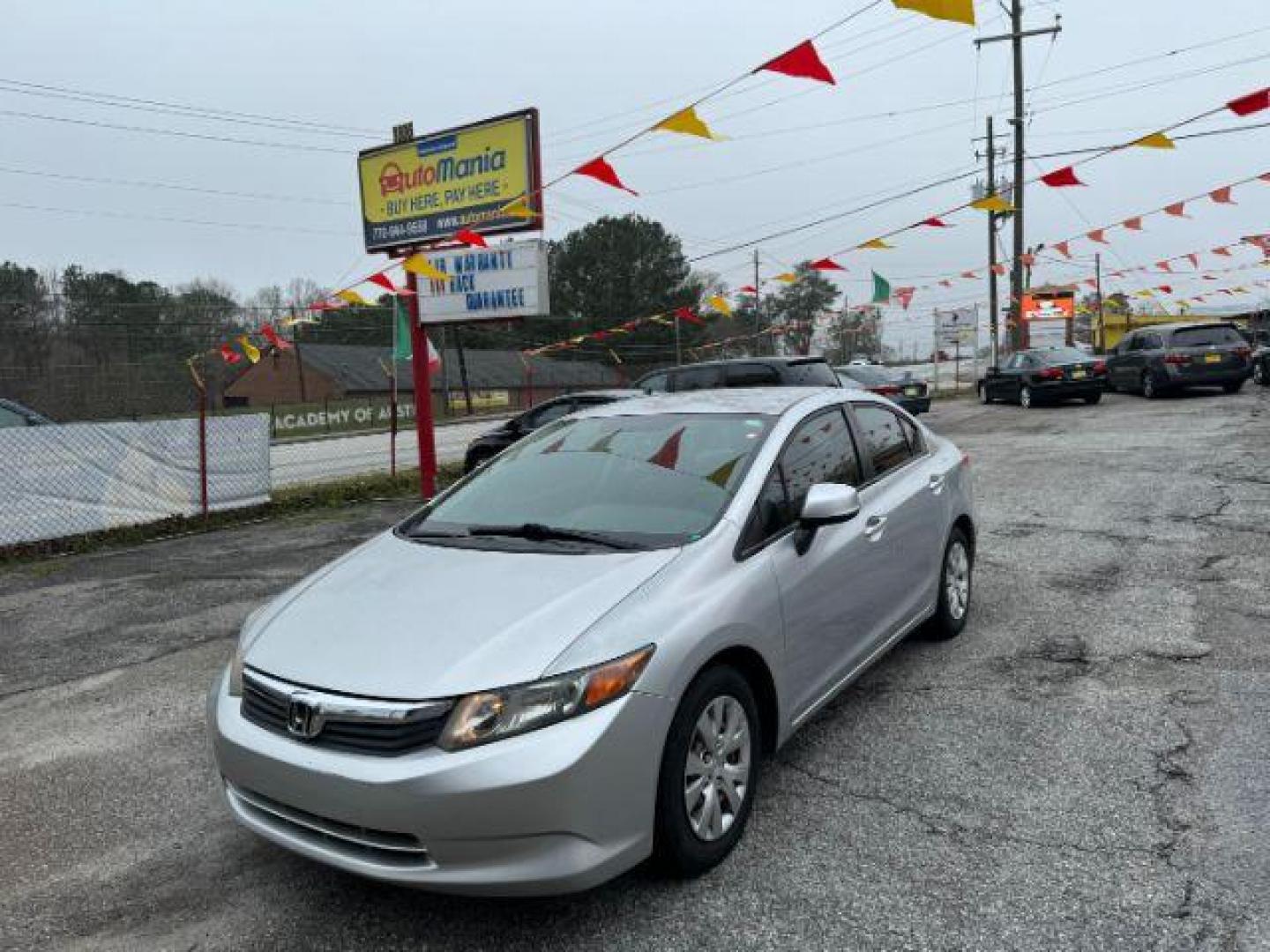 2012 Silver Honda Civic LX Sedan 5-Speed AT (2HGFB2F55CH) with an 1.8L L4 SOHC 16V engine, 5-Speed Automatic transmission, located at 1806 Veterans Memorial Hwy SW, Austell, GA, 30168, (770) 944-9558, 33.817959, -84.606987 - Photo#0