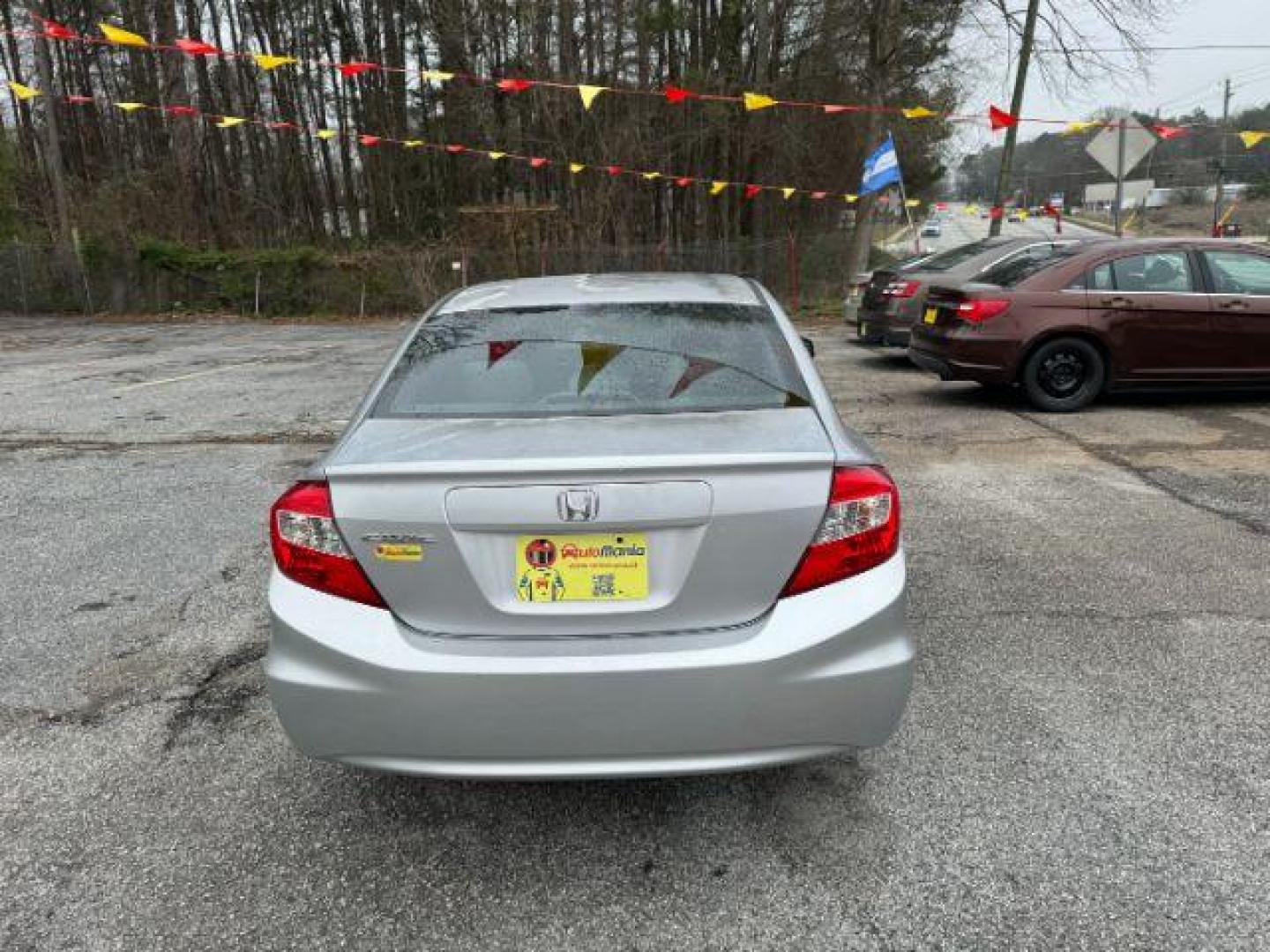 2012 Silver Honda Civic LX Sedan 5-Speed AT (2HGFB2F55CH) with an 1.8L L4 SOHC 16V engine, 5-Speed Automatic transmission, located at 1806 Veterans Memorial Hwy SW, Austell, GA, 30168, (770) 944-9558, 33.817959, -84.606987 - Photo#2