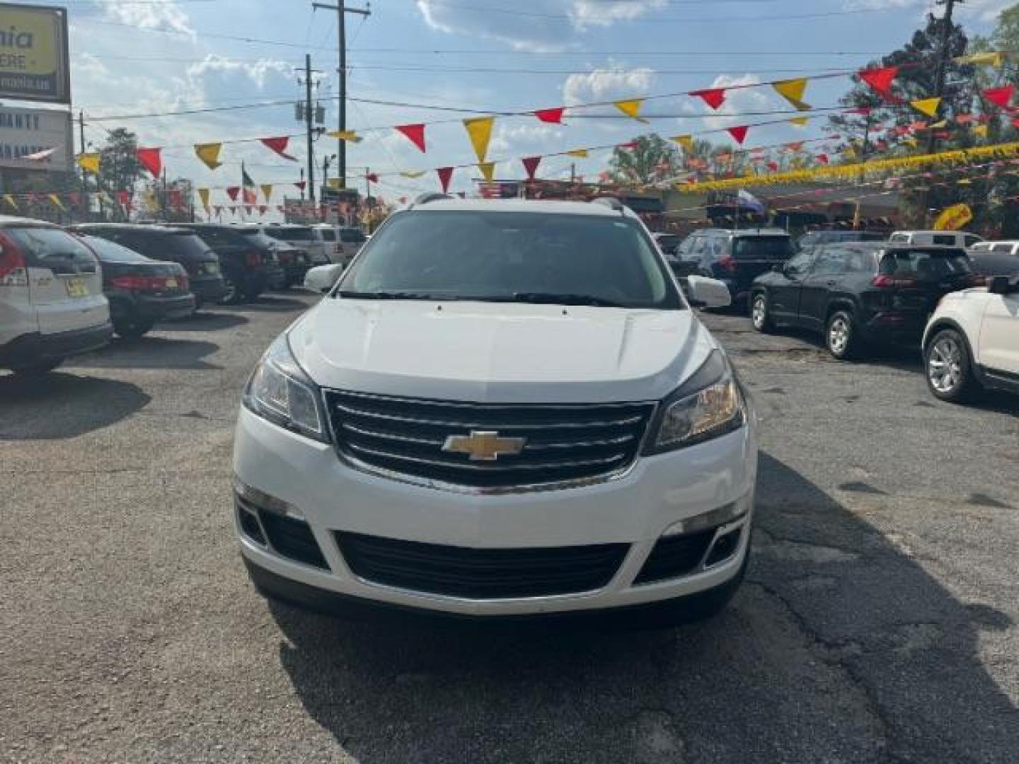 2016 White Chevrolet Traverse 2LT FWD (1GNKRHKD2GJ) with an 3.6L V6 DOHC 24V engine, 6-Speed Automatic transmission, located at 1806 Veterans Memorial Hwy SW, Austell, GA, 30168, (770) 944-9558, 33.817959, -84.606987 - Photo#1