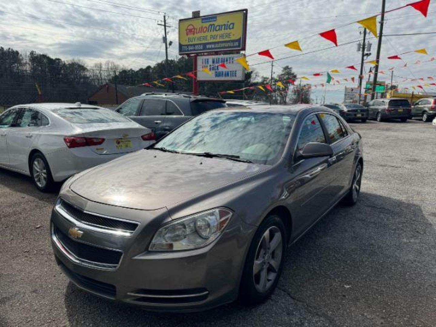 2012 Brown Chevrolet Malibu 1LT (1G1ZC5E08CF) with an 2.4L L4 DOHC 16V engine, 6-Speed Automatic transmission, located at 1806 Veterans Memorial Hwy SW, Austell, GA, 30168, (770) 944-9558, 33.817959, -84.606987 - Photo#0