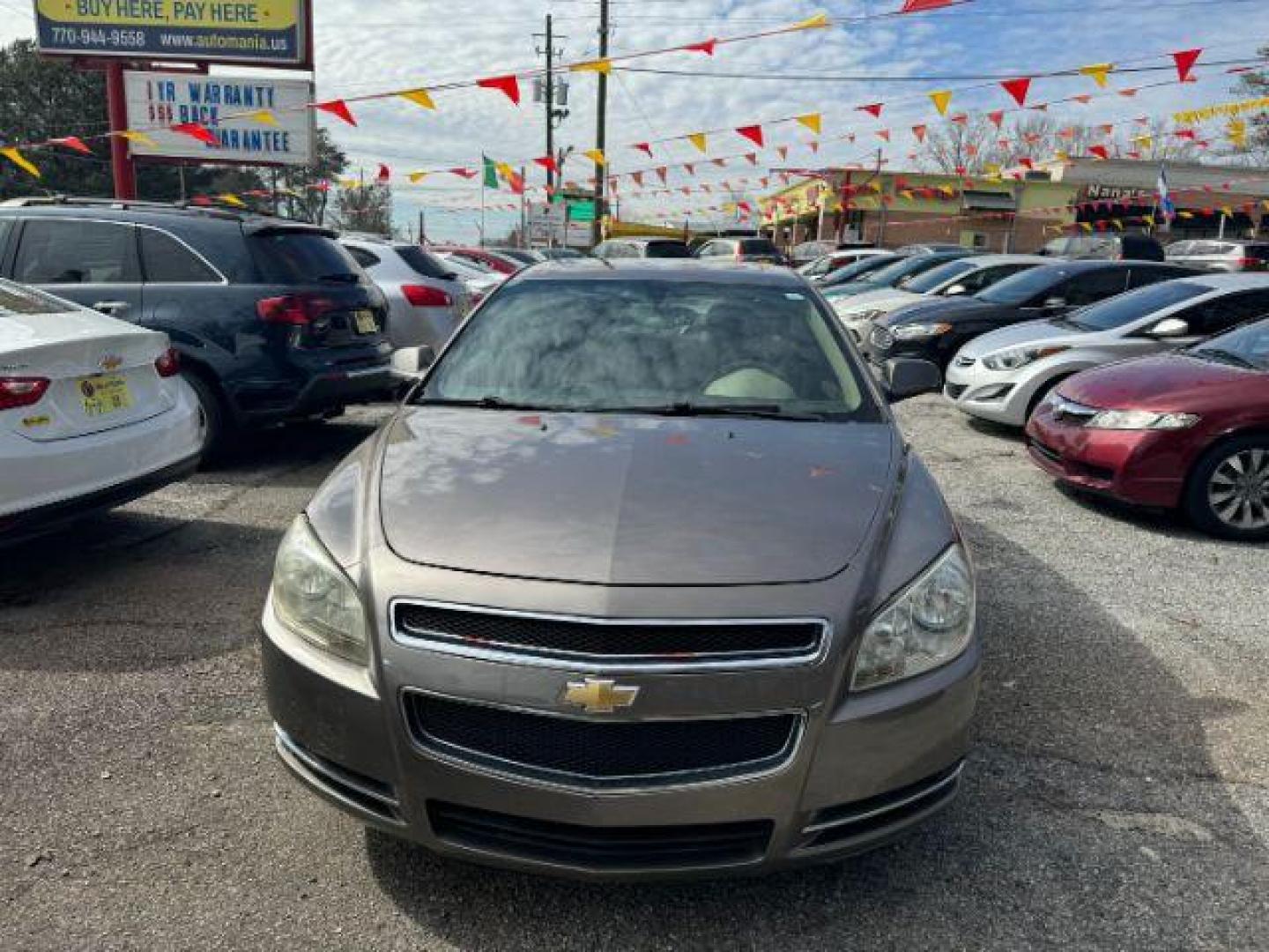 2012 Brown Chevrolet Malibu 1LT (1G1ZC5E08CF) with an 2.4L L4 DOHC 16V engine, 6-Speed Automatic transmission, located at 1806 Veterans Memorial Hwy SW, Austell, GA, 30168, (770) 944-9558, 33.817959, -84.606987 - Photo#1