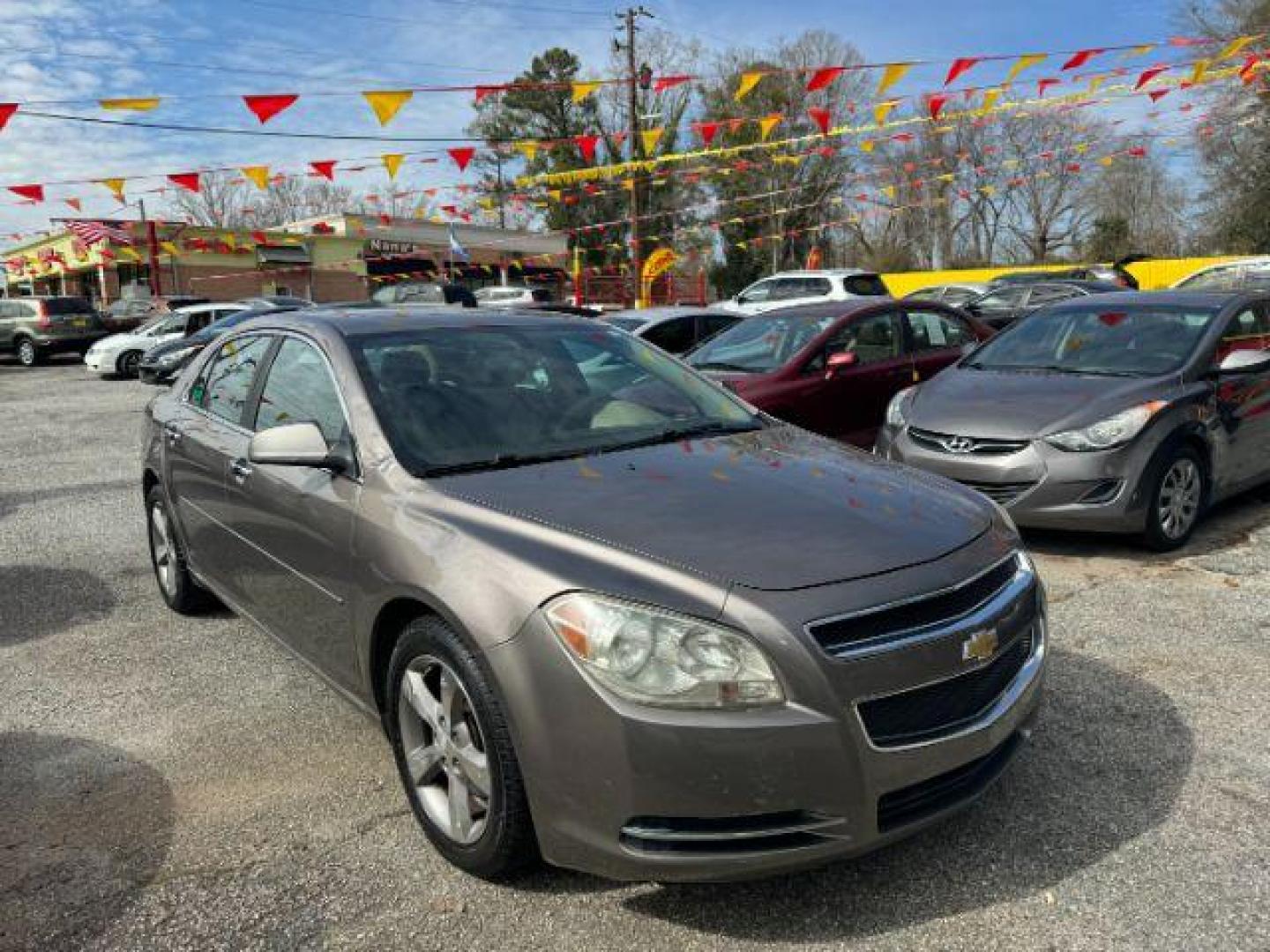 2012 Brown Chevrolet Malibu 1LT (1G1ZC5E08CF) with an 2.4L L4 DOHC 16V engine, 6-Speed Automatic transmission, located at 1806 Veterans Memorial Hwy SW, Austell, GA, 30168, (770) 944-9558, 33.817959, -84.606987 - Photo#2