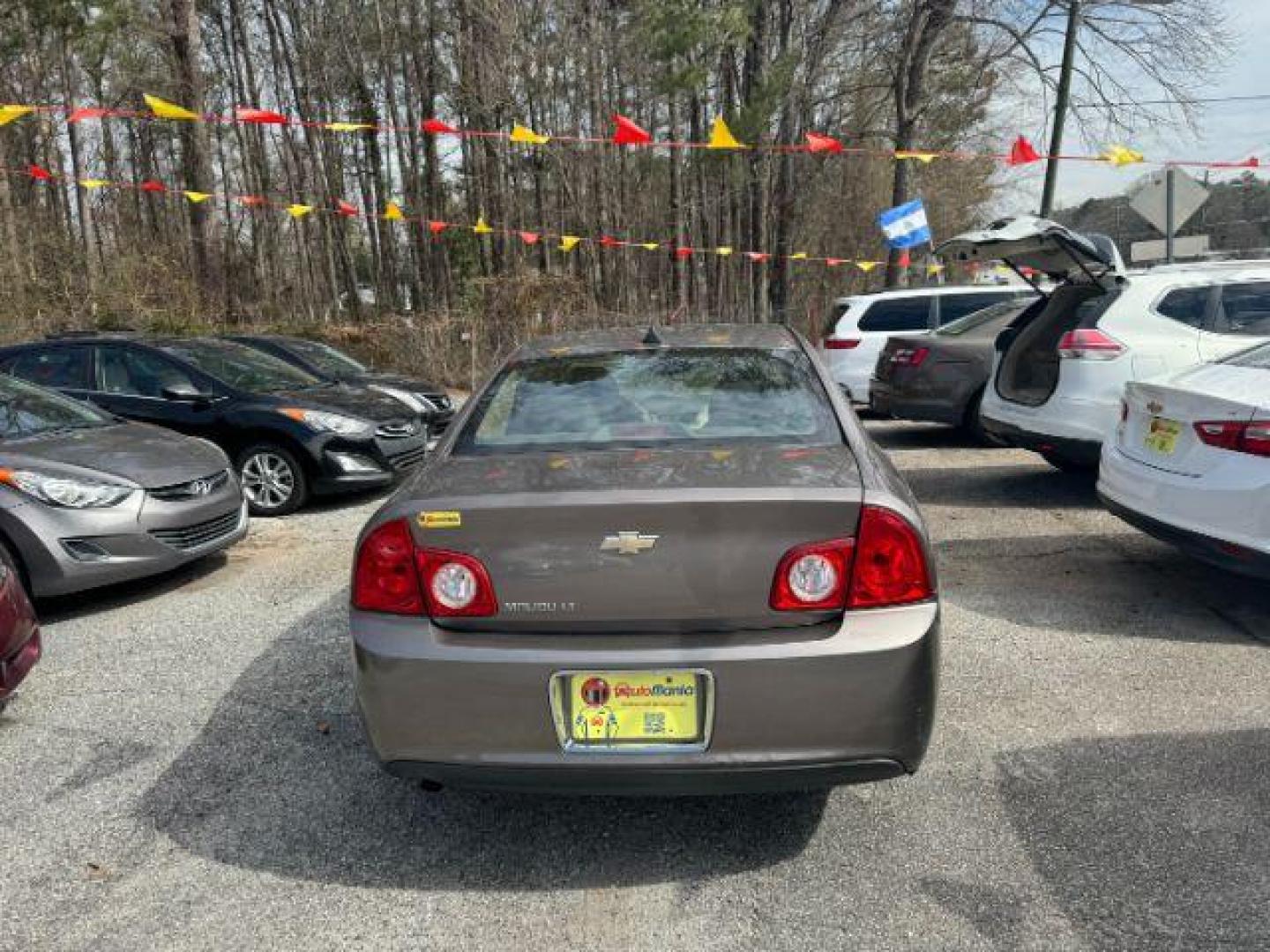 2012 Brown Chevrolet Malibu 1LT (1G1ZC5E08CF) with an 2.4L L4 DOHC 16V engine, 6-Speed Automatic transmission, located at 1806 Veterans Memorial Hwy SW, Austell, GA, 30168, (770) 944-9558, 33.817959, -84.606987 - Photo#4