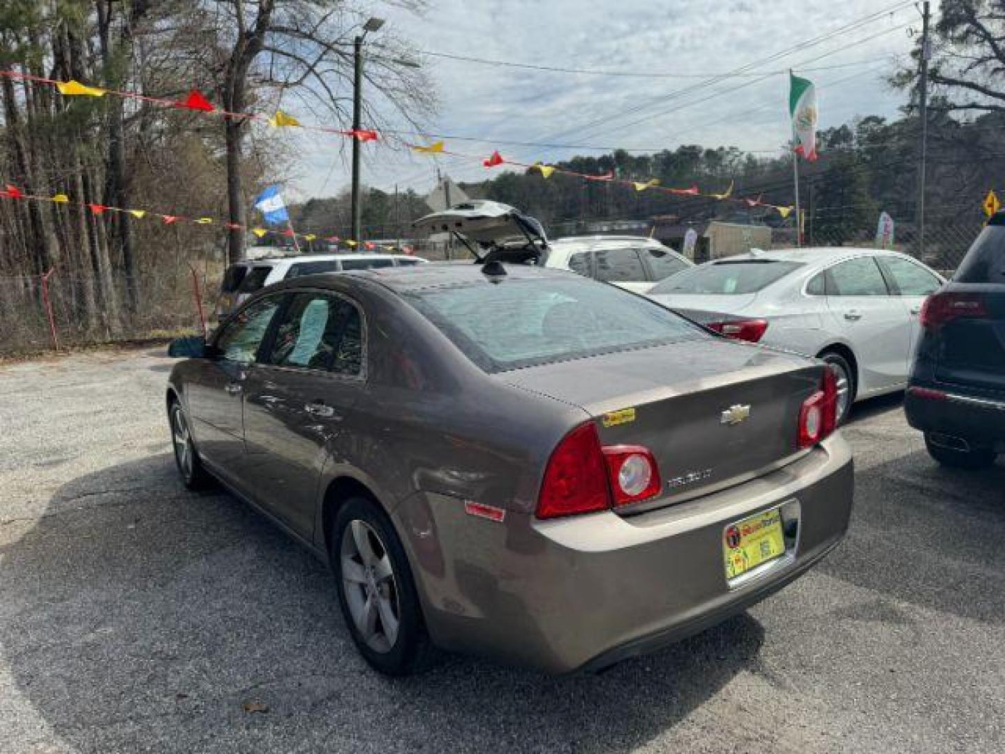 2012 Brown Chevrolet Malibu 1LT (1G1ZC5E08CF) with an 2.4L L4 DOHC 16V engine, 6-Speed Automatic transmission, located at 1806 Veterans Memorial Hwy SW, Austell, GA, 30168, (770) 944-9558, 33.817959, -84.606987 - Photo#5