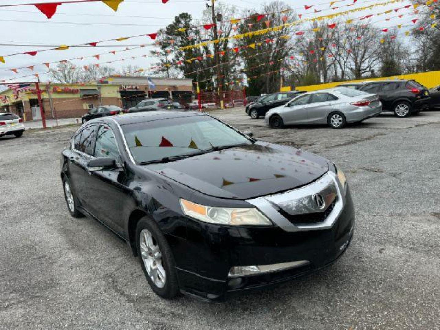 2009 Black Acura TL 5-Speed AT (19UUA86239A) with an 3.5L V6 SOHC 24V engine, 5-Speed Automatic transmission, located at 1806 Veterans Memorial Hwy SW, Austell, GA, 30168, (770) 944-9558, 33.817959, -84.606987 - Photo#2