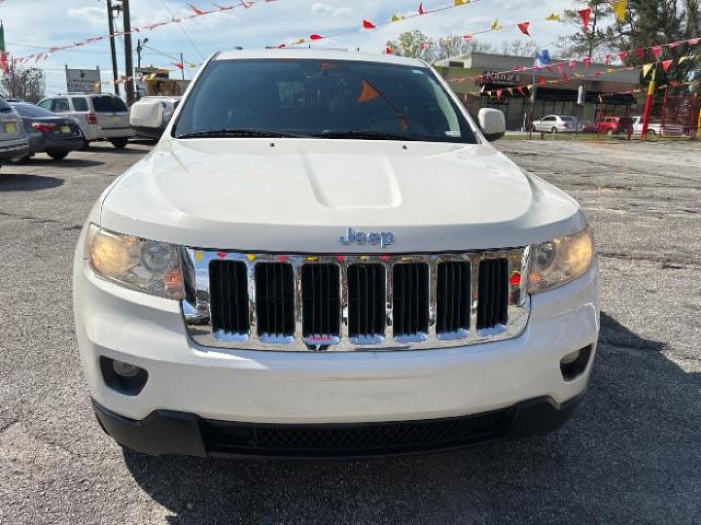 2012 White Jeep Grand Cherokee Laredo 2WD (1C4RJEAG5CC) with an 3.6L V6 DOHC 24V engine, 5-Speed Automatic transmission, located at 1806 Veterans Memorial Hwy SW, Austell, GA, 30168, (770) 944-9558, 33.817959, -84.606987 - Photo#1