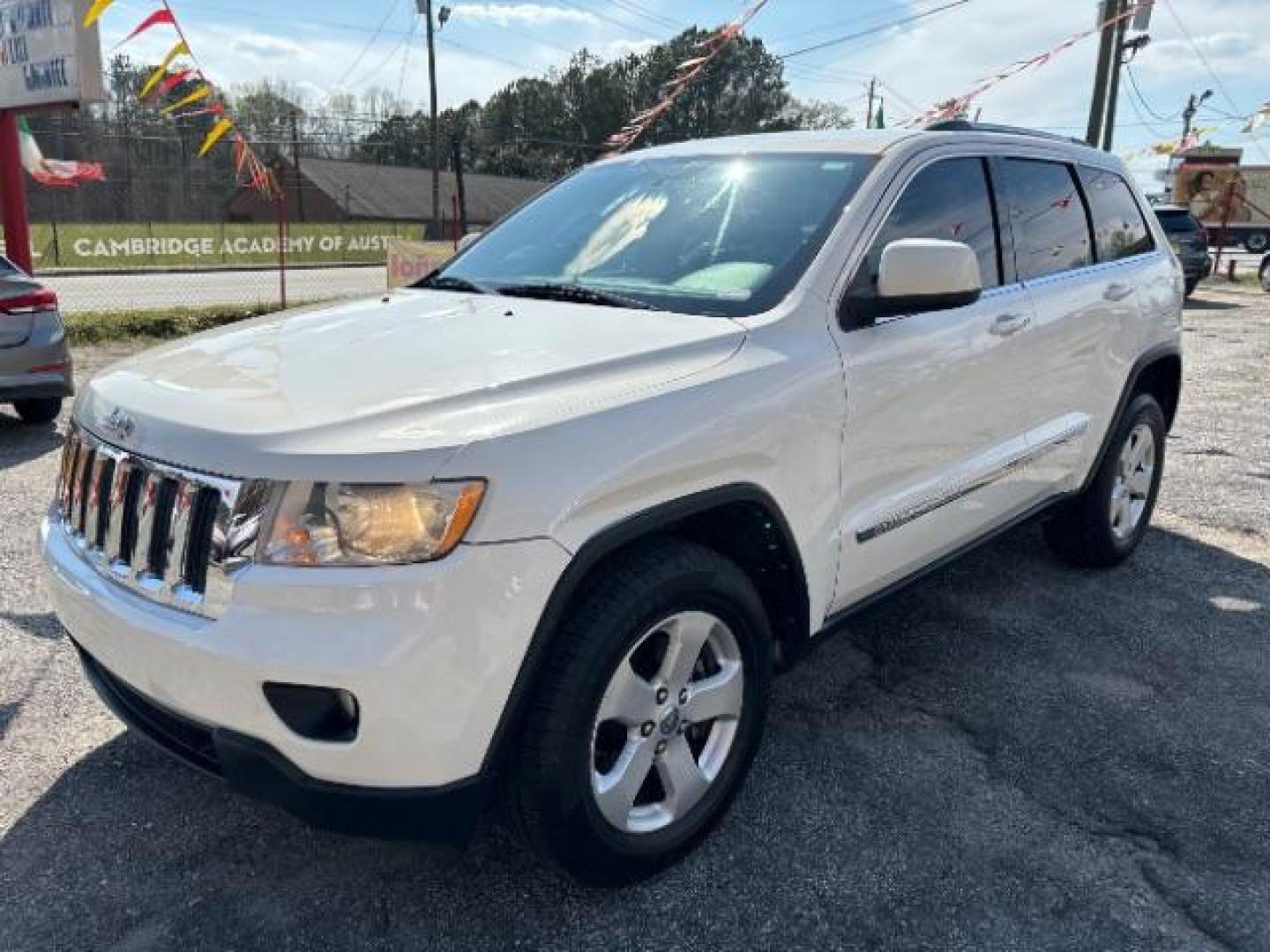 2012 White Jeep Grand Cherokee Laredo 2WD (1C4RJEAG5CC) with an 3.6L V6 DOHC 24V engine, 5-Speed Automatic transmission, located at 1806 Veterans Memorial Hwy SW, Austell, GA, 30168, (770) 944-9558, 33.817959, -84.606987 - Photo#2