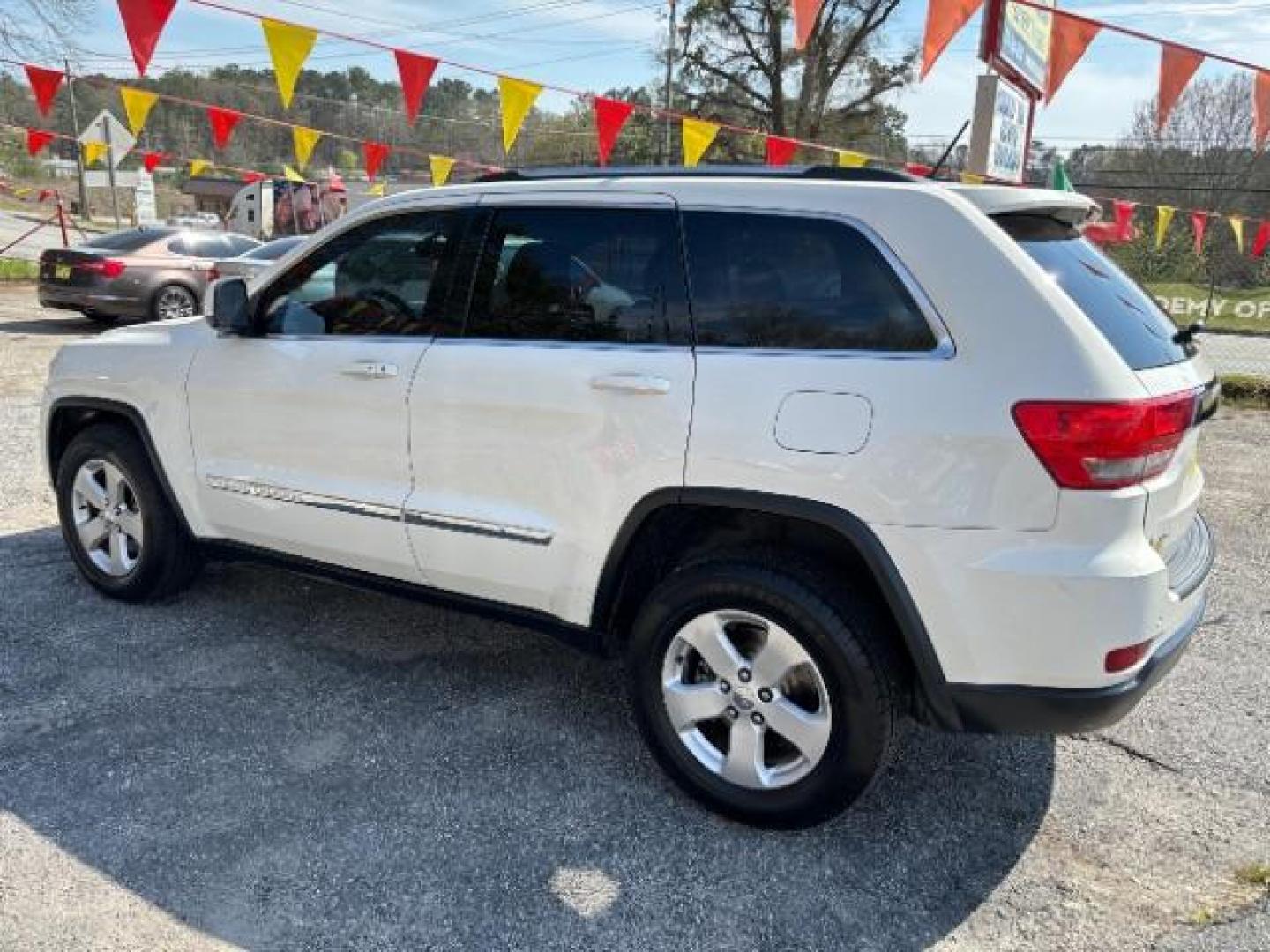 2012 White Jeep Grand Cherokee Laredo 2WD (1C4RJEAG5CC) with an 3.6L V6 DOHC 24V engine, 5-Speed Automatic transmission, located at 1806 Veterans Memorial Hwy SW, Austell, GA, 30168, (770) 944-9558, 33.817959, -84.606987 - Photo#4