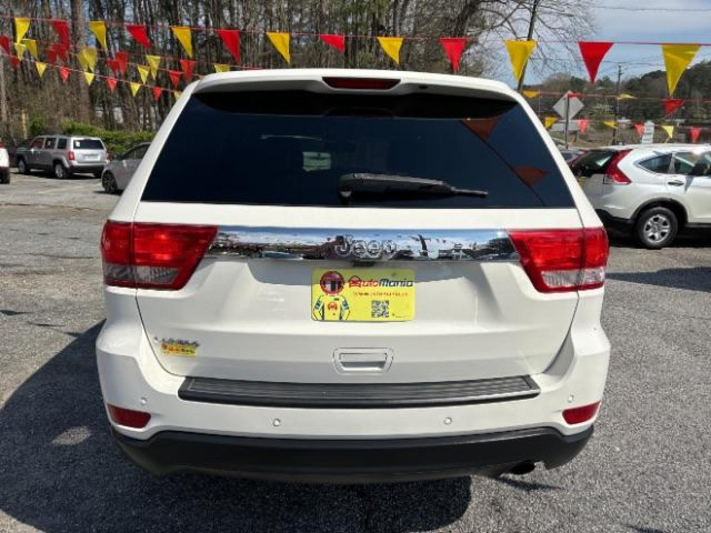 2012 White Jeep Grand Cherokee Laredo 2WD (1C4RJEAG5CC) with an 3.6L V6 DOHC 24V engine, 5-Speed Automatic transmission, located at 1806 Veterans Memorial Hwy SW, Austell, GA, 30168, (770) 944-9558, 33.817959, -84.606987 - Photo#5