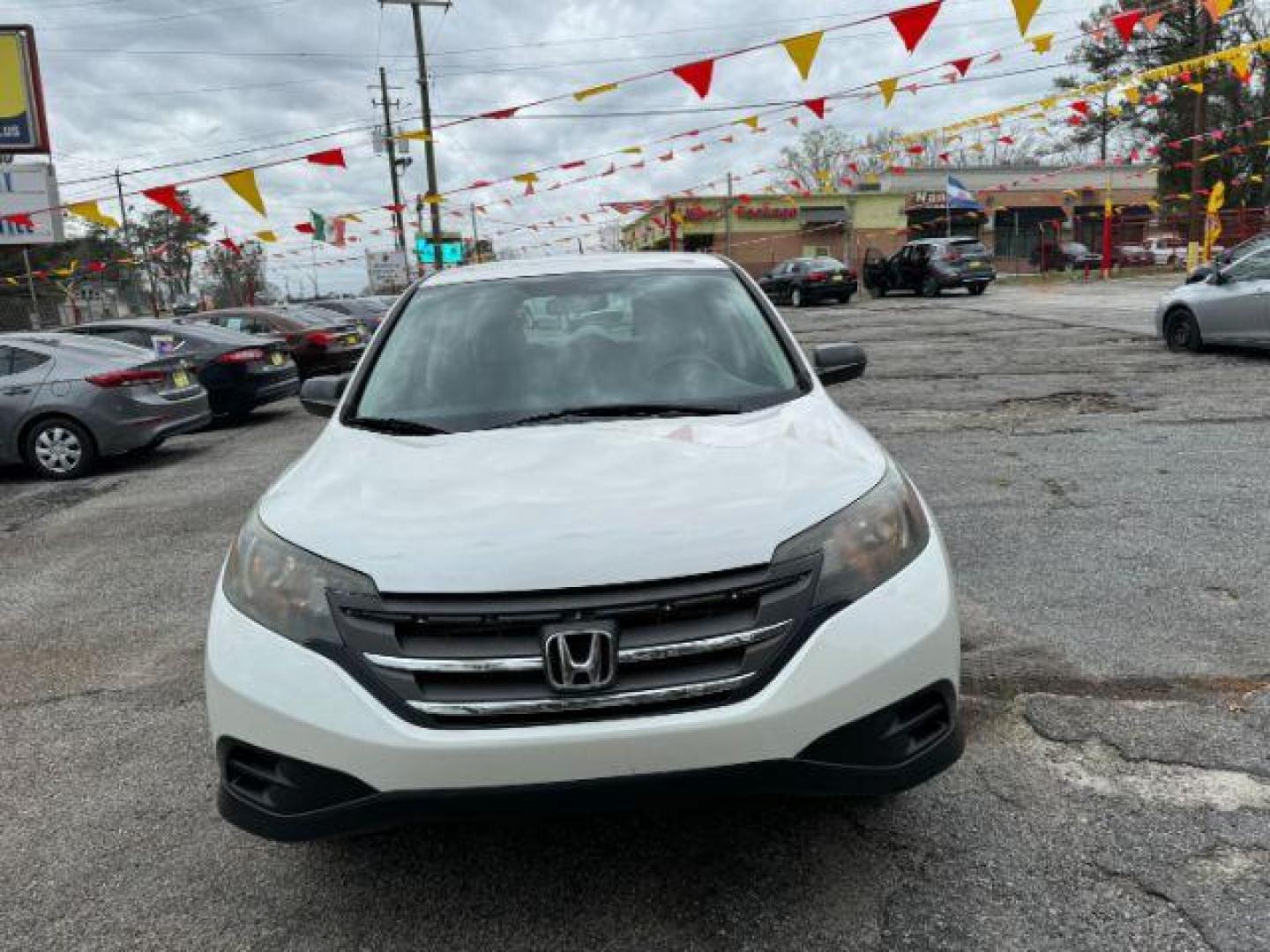 2014 White Honda CR-V LX 2WD 5-Speed AT (5J6RM3H38EL) with an 2.4L L4 DOHC 16V engine, 5-Speed Automatic transmission, located at 1806 Veterans Memorial Hwy SW, Austell, GA, 30168, (770) 944-9558, 33.817959, -84.606987 - Photo#2