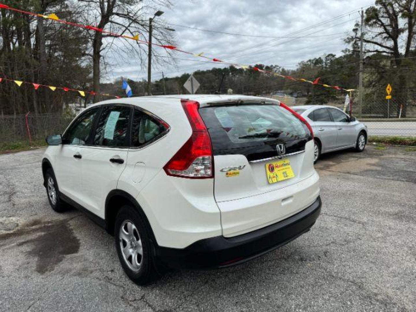 2014 White Honda CR-V LX 2WD 5-Speed AT (5J6RM3H38EL) with an 2.4L L4 DOHC 16V engine, 5-Speed Automatic transmission, located at 1806 Veterans Memorial Hwy SW, Austell, GA, 30168, (770) 944-9558, 33.817959, -84.606987 - Photo#6