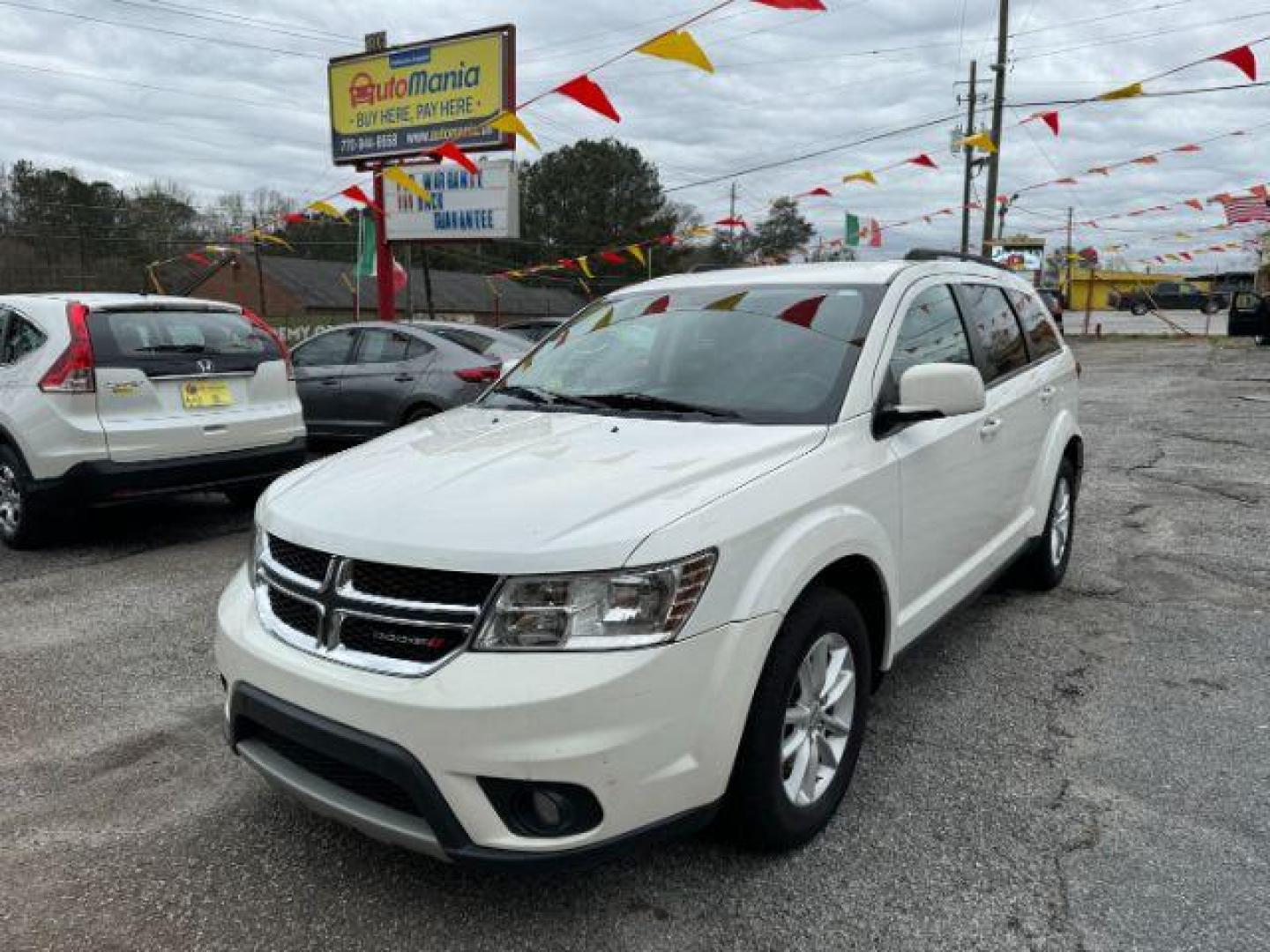 2016 White Dodge Journey SXT (3C4PDCBB7GT) with an 2.4L L6 DOHC 16V engine, 4-Speed Automatic transmission, located at 1806 Veterans Memorial Hwy SW, Austell, GA, 30168, (770) 944-9558, 33.817959, -84.606987 - Photo#0