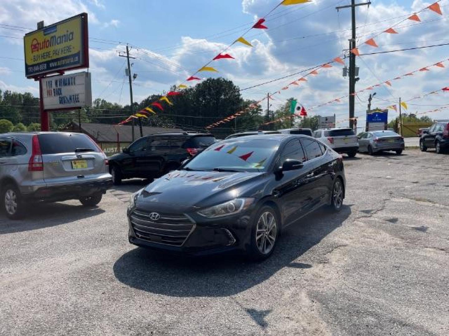 2017 Black Hyundai Elantra Limited (5NPD84LFXHH) with an 1.8L L4 DOHC 16V engine, 6-Speed Automatic transmission, located at 1806 Veterans Memorial Hwy SW, Austell, GA, 30168, (770) 944-9558, 33.817959, -84.606987 - Photo#1