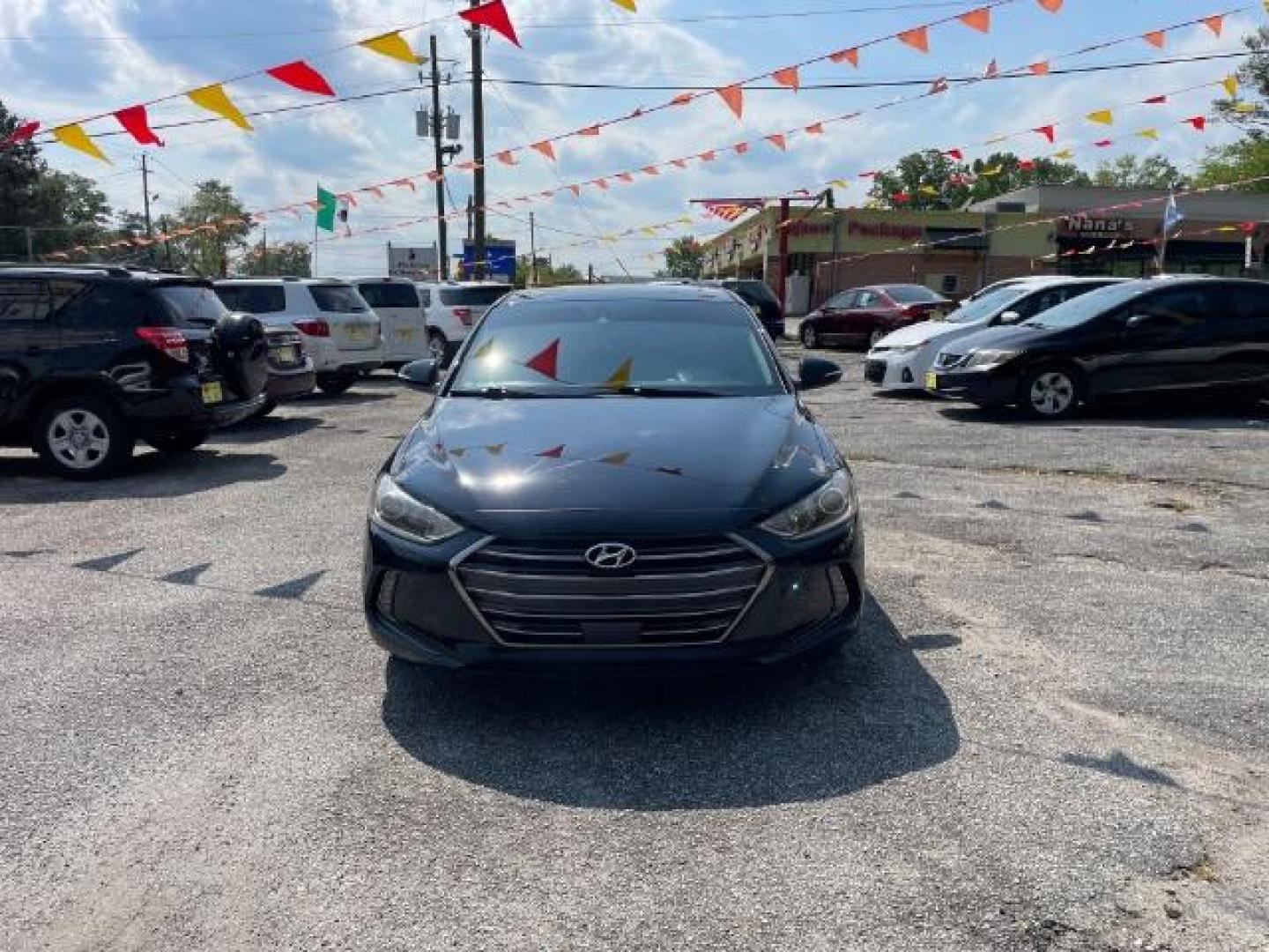 2017 Black Hyundai Elantra Limited (5NPD84LFXHH) with an 1.8L L4 DOHC 16V engine, 6-Speed Automatic transmission, located at 1806 Veterans Memorial Hwy SW, Austell, GA, 30168, (770) 944-9558, 33.817959, -84.606987 - Photo#2