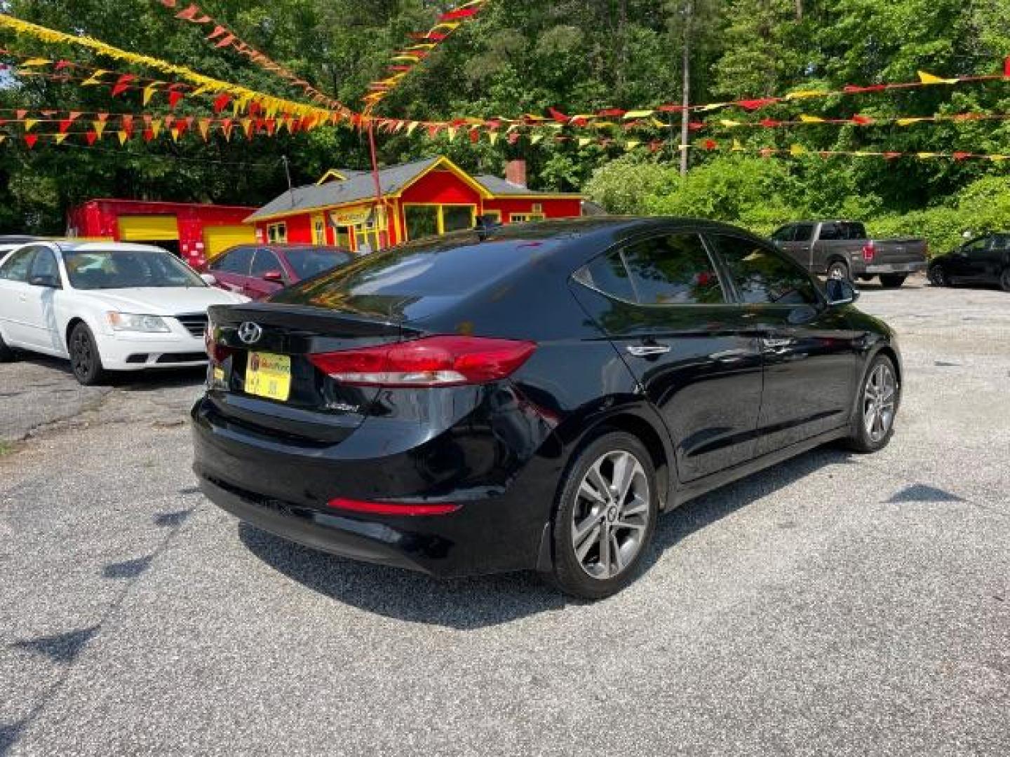 2017 Black Hyundai Elantra Limited (5NPD84LFXHH) with an 1.8L L4 DOHC 16V engine, 6-Speed Automatic transmission, located at 1806 Veterans Memorial Hwy SW, Austell, GA, 30168, (770) 944-9558, 33.817959, -84.606987 - Photo#3