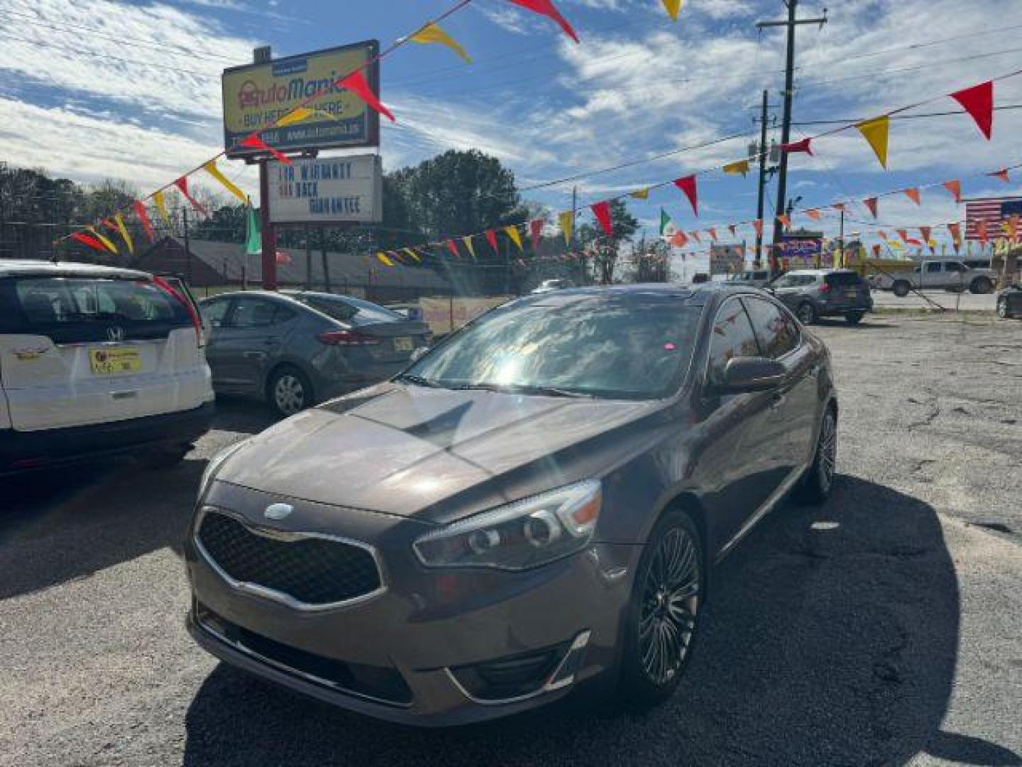 2014 Brown Kia Cadenza Limited (KNALN4D78E5) with an 3.3L V6 DOHC 24V engine, 6-Speed Automatic transmission, located at 1806 Veterans Memorial Hwy SW, Austell, GA, 30168, (770) 944-9558, 33.817959, -84.606987 - Photo#0