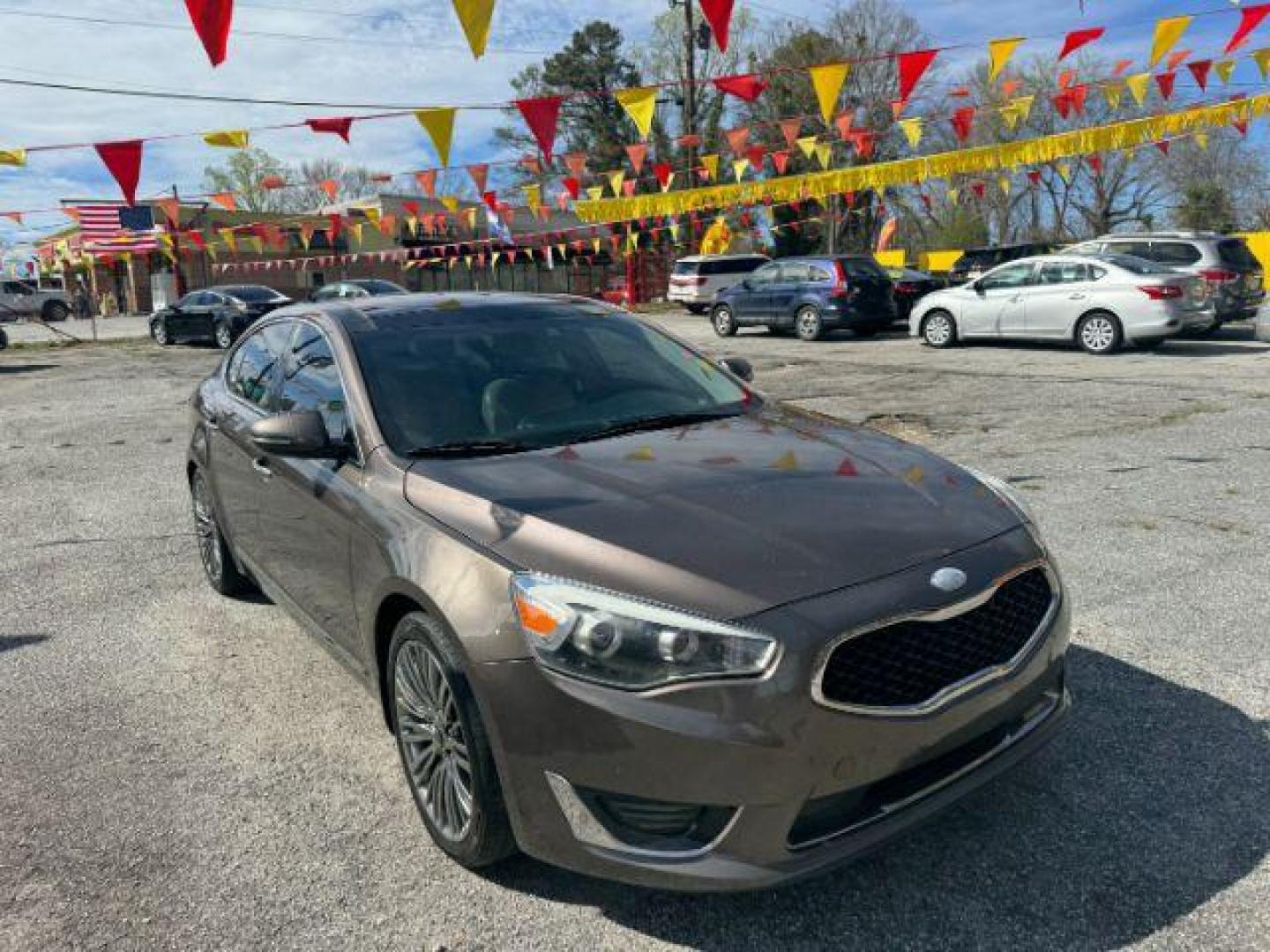 2014 Brown Kia Cadenza Limited (KNALN4D78E5) with an 3.3L V6 DOHC 24V engine, 6-Speed Automatic transmission, located at 1806 Veterans Memorial Hwy SW, Austell, GA, 30168, (770) 944-9558, 33.817959, -84.606987 - Photo#2