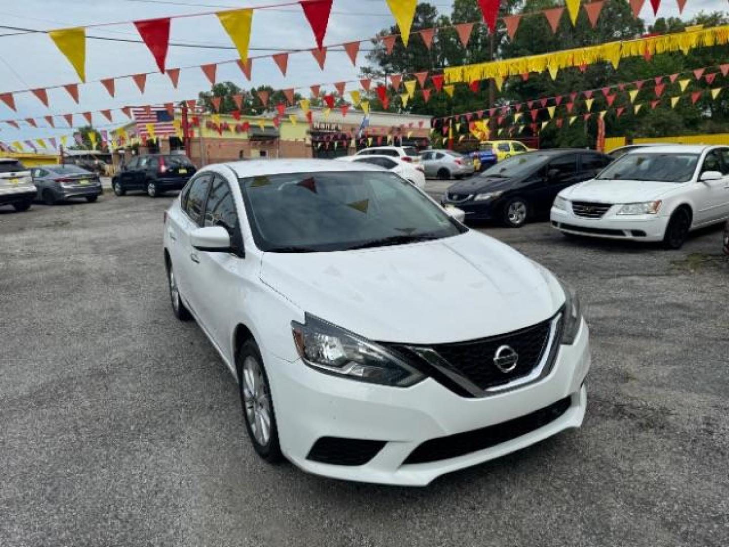 2018 White Nissan Sentra S CVT (3N1AB7AP5JL) with an 1.8L L4 SFI DOHC 16V engine, Continuously Variable Transmission transmission, located at 1806 Veterans Memorial Hwy SW, Austell, GA, 30168, (770) 944-9558, 33.817959, -84.606987 - Photo#2