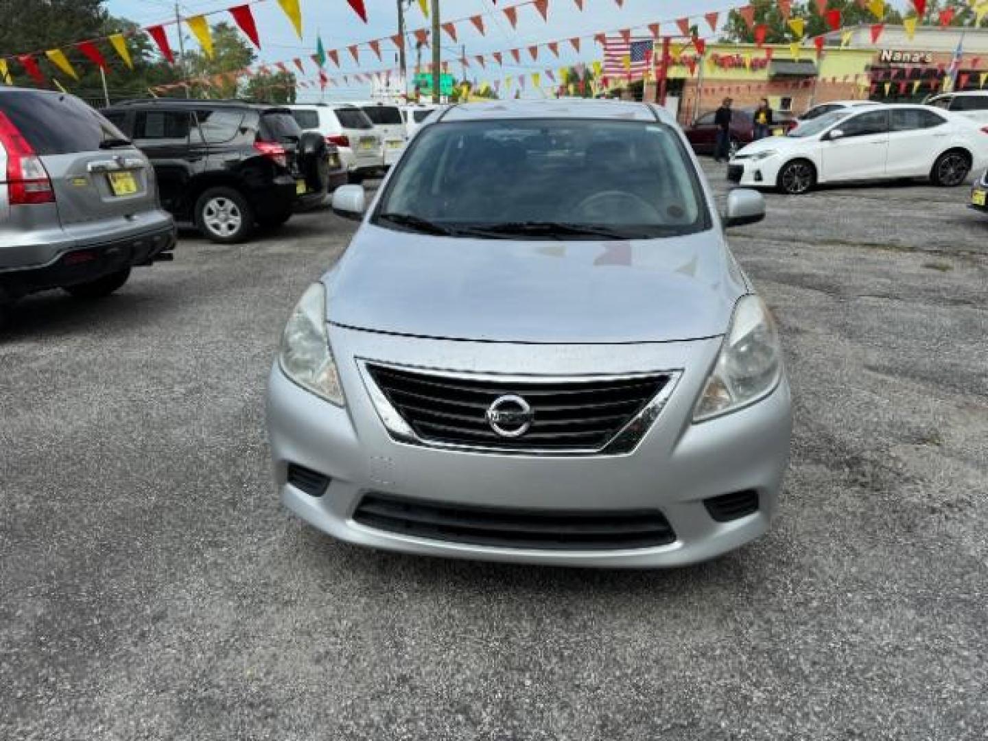 2014 Silver Nissan Versa 1.6 S 4A (3N1CN7AP5EL) with an 1.6L L4 DOHC 16V engine, 4-Speed Automatic transmission, located at 1806 Veterans Memorial Hwy SW, Austell, GA, 30168, (770) 944-9558, 33.817959, -84.606987 - Photo#1