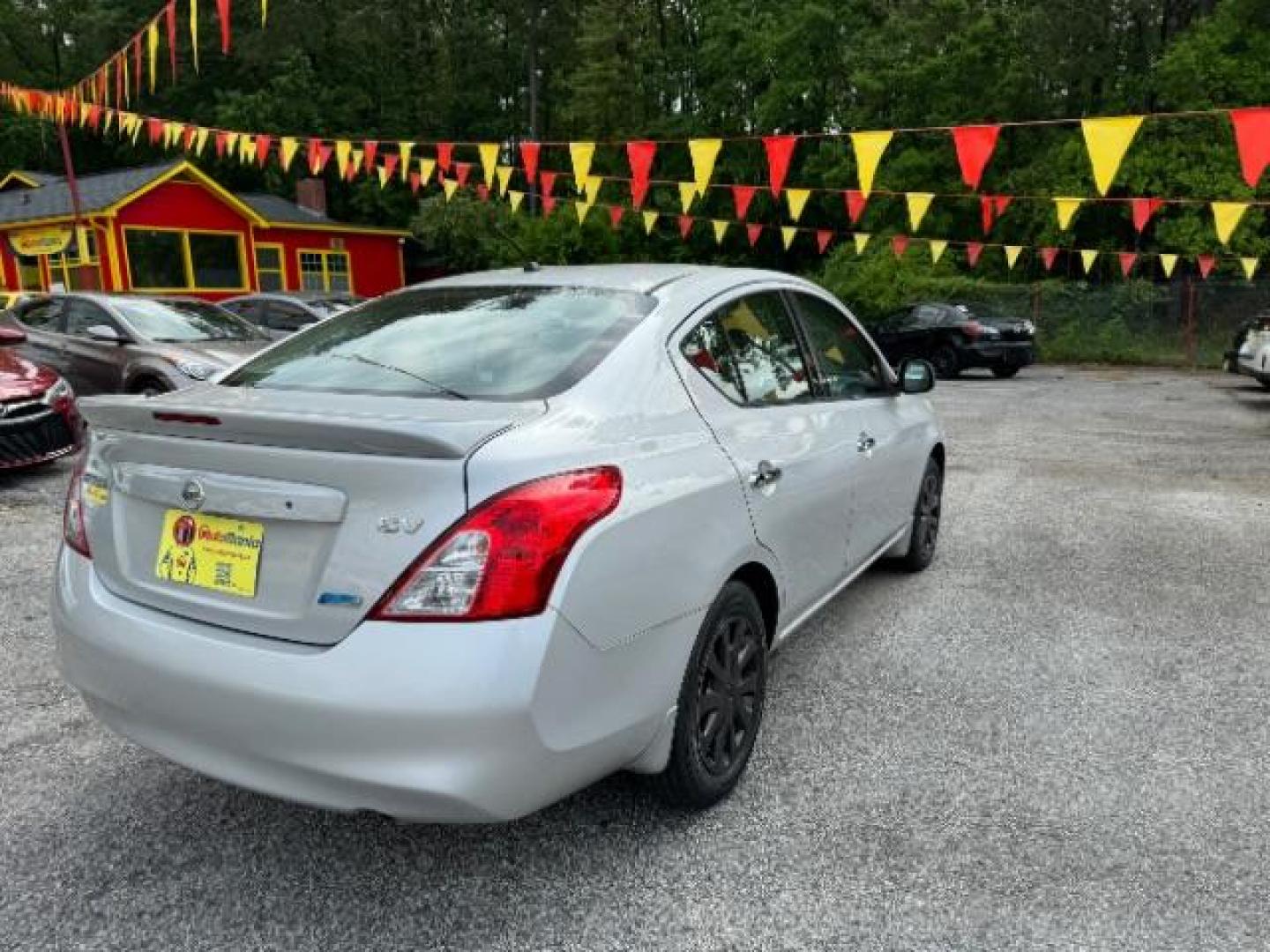 2014 Silver Nissan Versa 1.6 S 4A (3N1CN7AP5EL) with an 1.6L L4 DOHC 16V engine, 4-Speed Automatic transmission, located at 1806 Veterans Memorial Hwy SW, Austell, GA, 30168, (770) 944-9558, 33.817959, -84.606987 - Photo#3