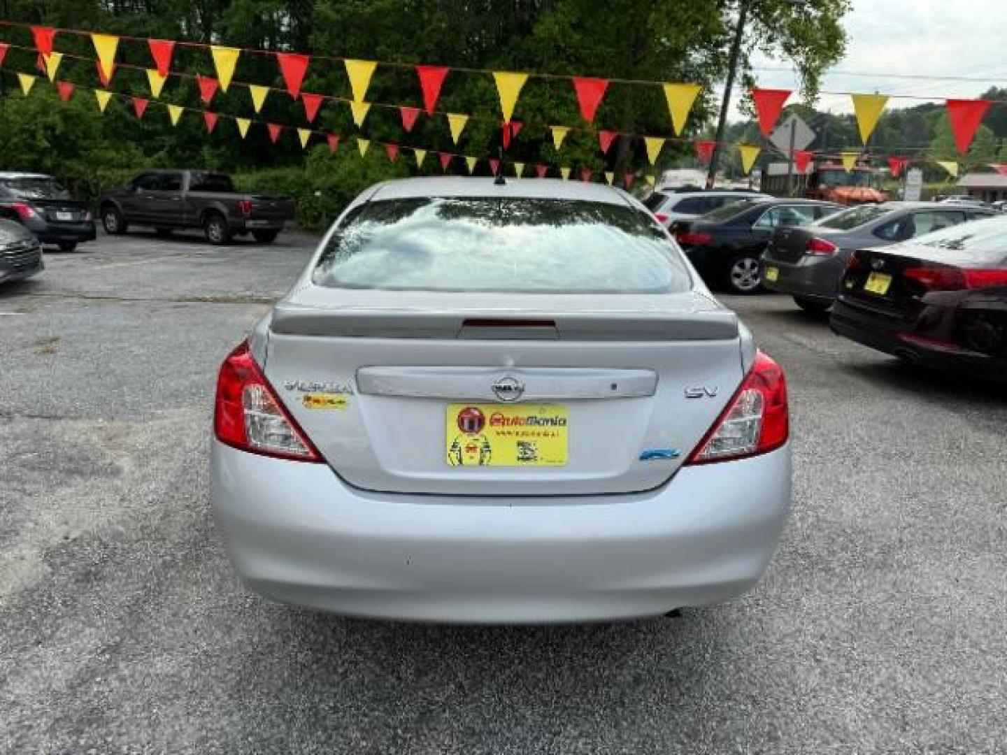 2014 Silver Nissan Versa 1.6 S 4A (3N1CN7AP5EL) with an 1.6L L4 DOHC 16V engine, 4-Speed Automatic transmission, located at 1806 Veterans Memorial Hwy SW, Austell, GA, 30168, (770) 944-9558, 33.817959, -84.606987 - Photo#4