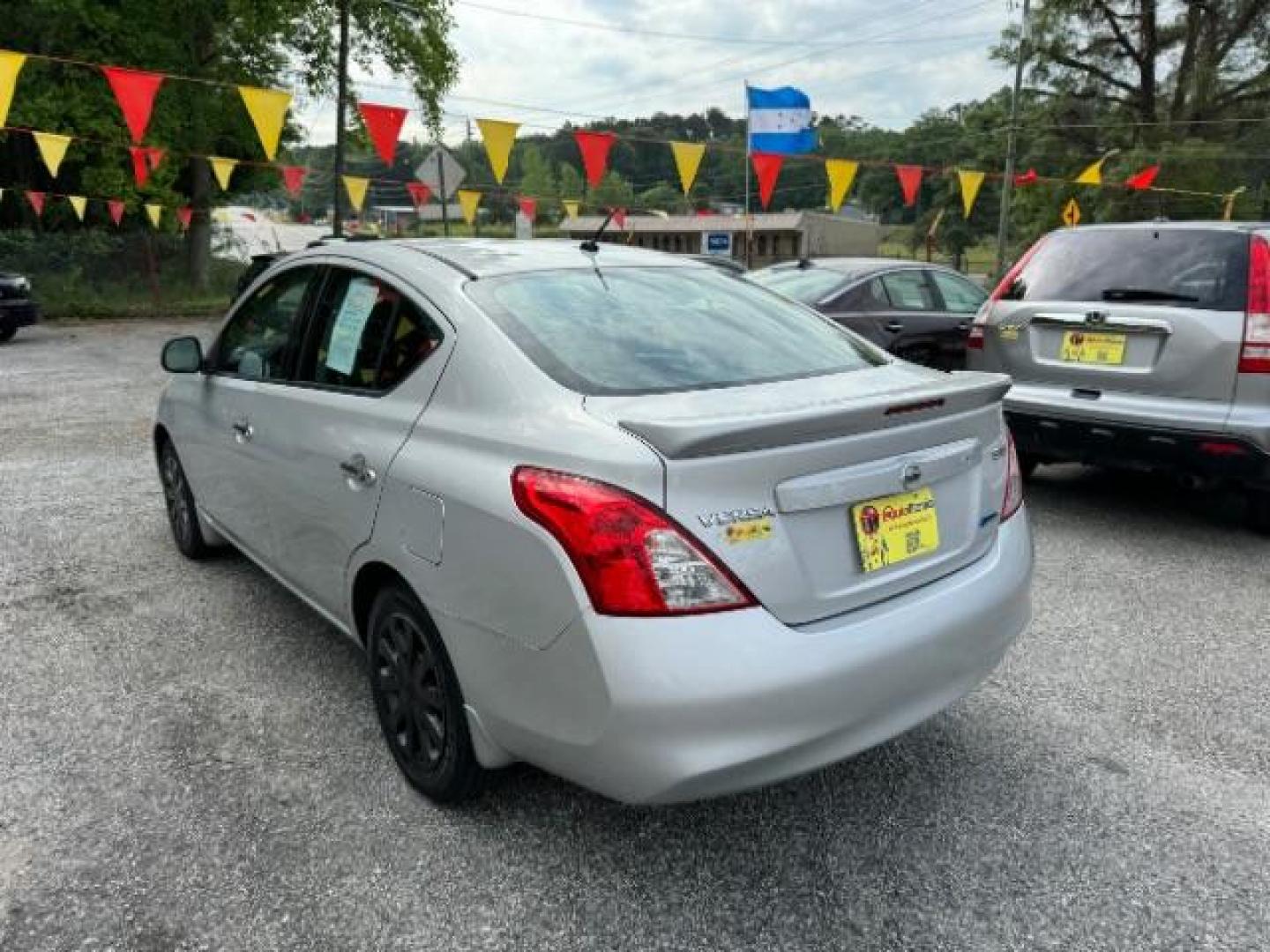 2014 Silver Nissan Versa 1.6 S 4A (3N1CN7AP5EL) with an 1.6L L4 DOHC 16V engine, 4-Speed Automatic transmission, located at 1806 Veterans Memorial Hwy SW, Austell, GA, 30168, (770) 944-9558, 33.817959, -84.606987 - Photo#5