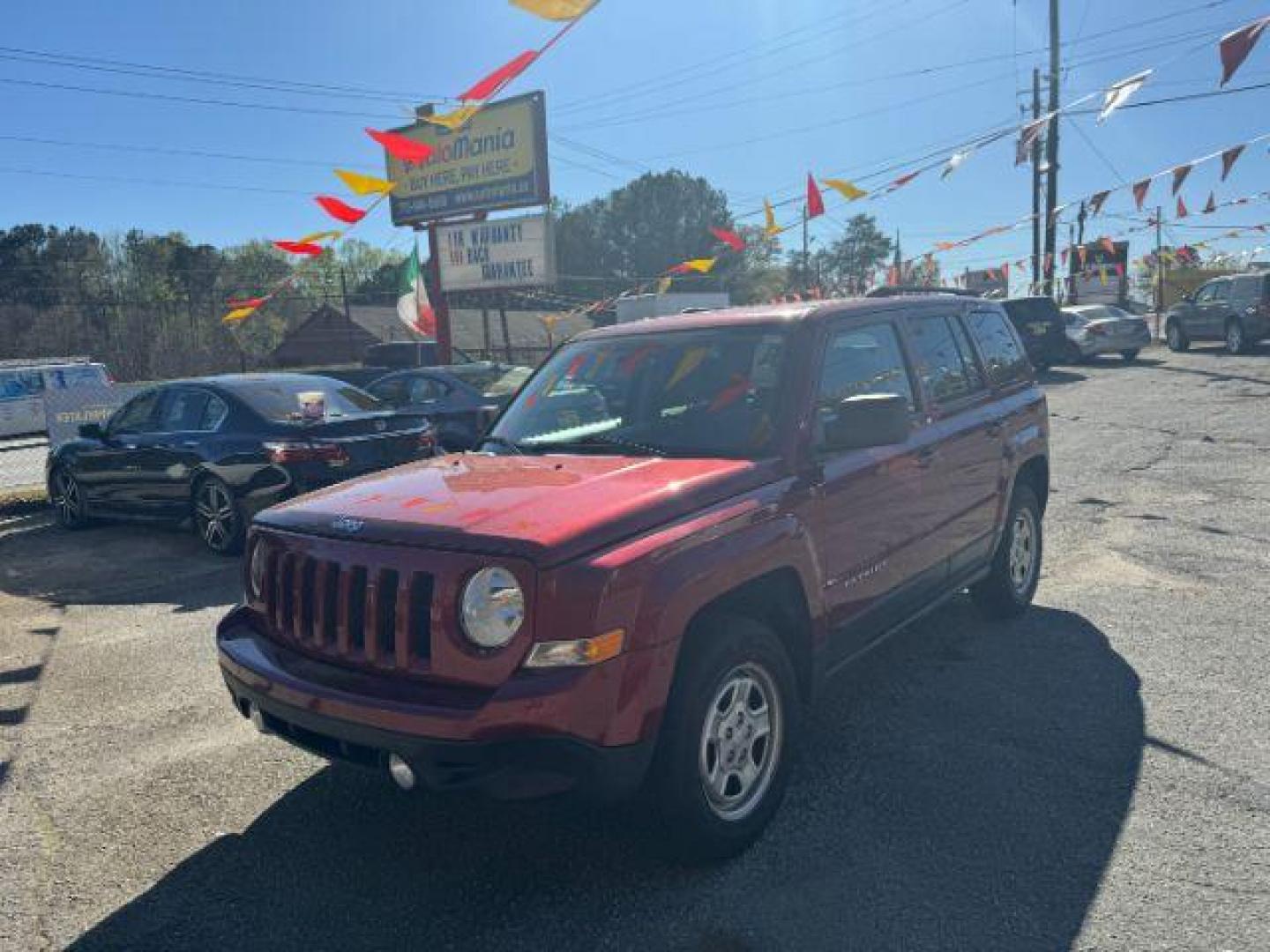 2016 Red Jeep Patriot Sport 4WD (1C4NJRBB6GD) with an 2.4L L4 DOHC 16V engine, located at 1806 Veterans Memorial Hwy SW, Austell, GA, 30168, (770) 944-9558, 33.817959, -84.606987 - Photo#0