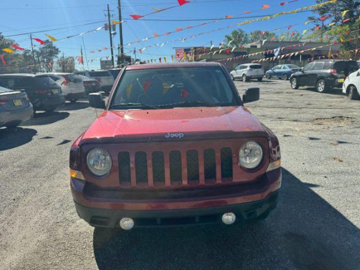 2016 Red Jeep Patriot Sport 4WD (1C4NJRBB6GD) with an 2.4L L4 DOHC 16V engine, located at 1806 Veterans Memorial Hwy SW, Austell, GA, 30168, (770) 944-9558, 33.817959, -84.606987 - Photo#1