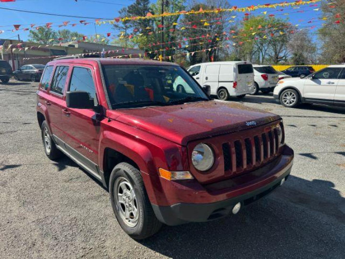 2016 Red Jeep Patriot Sport 4WD (1C4NJRBB6GD) with an 2.4L L4 DOHC 16V engine, located at 1806 Veterans Memorial Hwy SW, Austell, GA, 30168, (770) 944-9558, 33.817959, -84.606987 - Photo#2