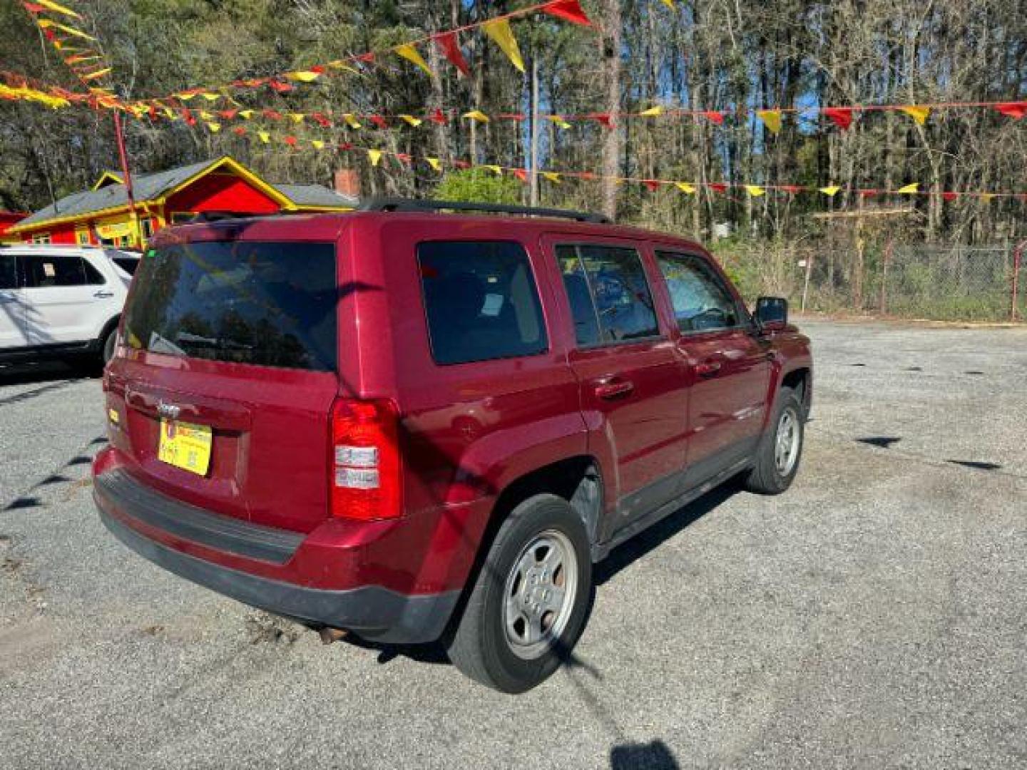 2016 Red Jeep Patriot Sport 4WD (1C4NJRBB6GD) with an 2.4L L4 DOHC 16V engine, located at 1806 Veterans Memorial Hwy SW, Austell, GA, 30168, (770) 944-9558, 33.817959, -84.606987 - Photo#3