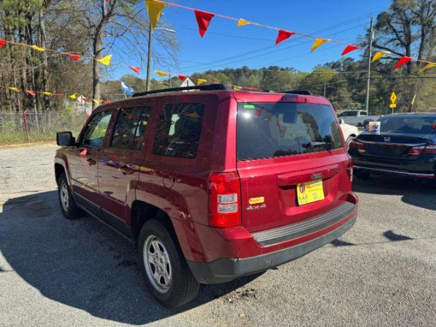 2016 Red Jeep Patriot Sport 4WD (1C4NJRBB6GD) with an 2.4L L4 DOHC 16V engine, located at 1806 Veterans Memorial Hwy SW, Austell, GA, 30168, (770) 944-9558, 33.817959, -84.606987 - Photo#5