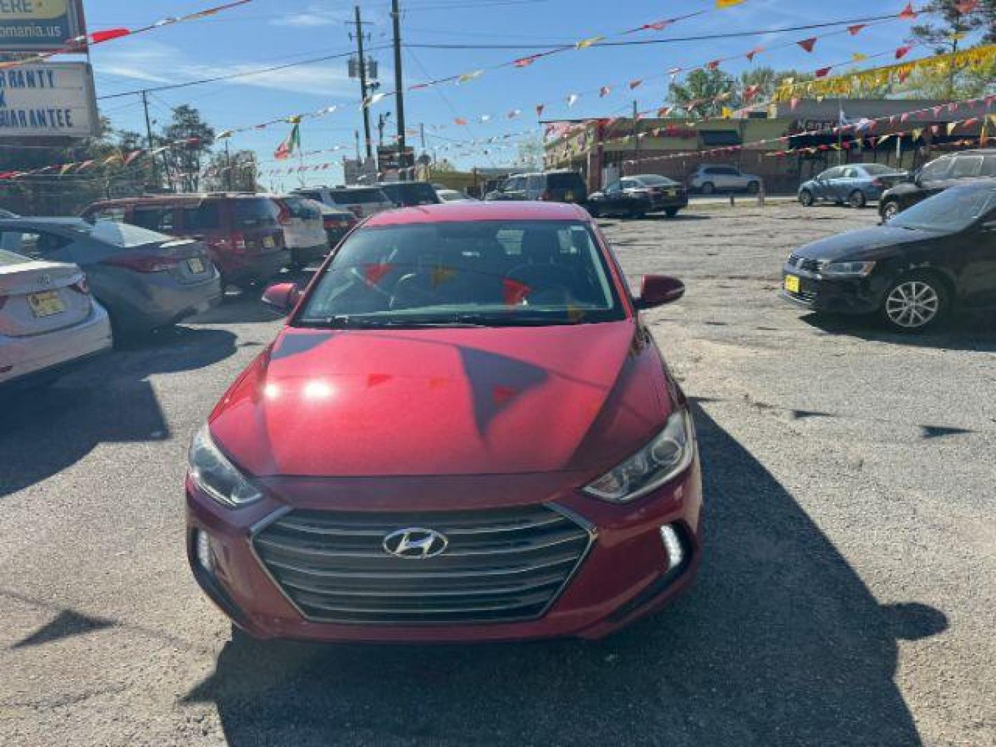 2017 Red Hyundai Elantra Limited (5NPD84LFXHH) with an 1.8L L4 DOHC 16V engine, 6-Speed Automatic transmission, located at 1806 Veterans Memorial Hwy SW, Austell, GA, 30168, (770) 944-9558, 33.817959, -84.606987 - Photo#1