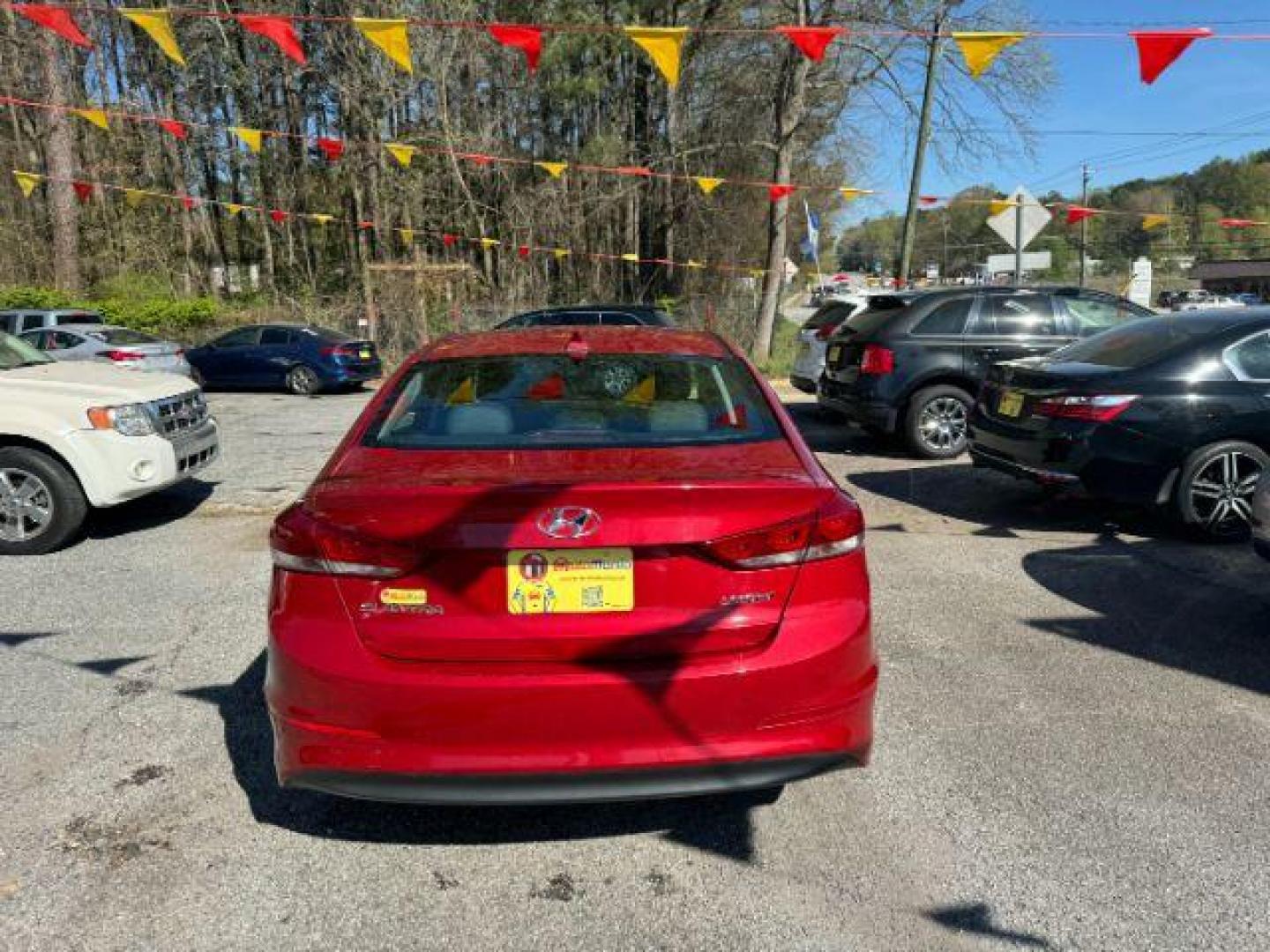 2017 Red Hyundai Elantra Limited (5NPD84LFXHH) with an 1.8L L4 DOHC 16V engine, 6-Speed Automatic transmission, located at 1806 Veterans Memorial Hwy SW, Austell, GA, 30168, (770) 944-9558, 33.817959, -84.606987 - Photo#2