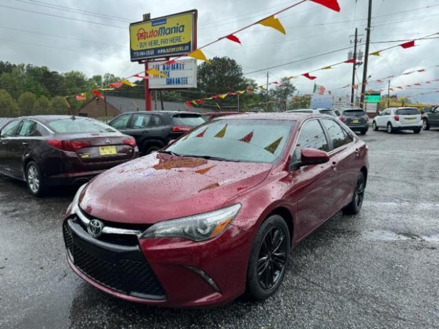 2016 Red Toyota Camry SE (4T1BF1FK4GU) with an 2.5L L4 DOHC 16V engine, 6-Speed Automatic transmission, located at 1806 Veterans Memorial Hwy SW, Austell, GA, 30168, (770) 944-9558, 33.817959, -84.606987 - Photo#0