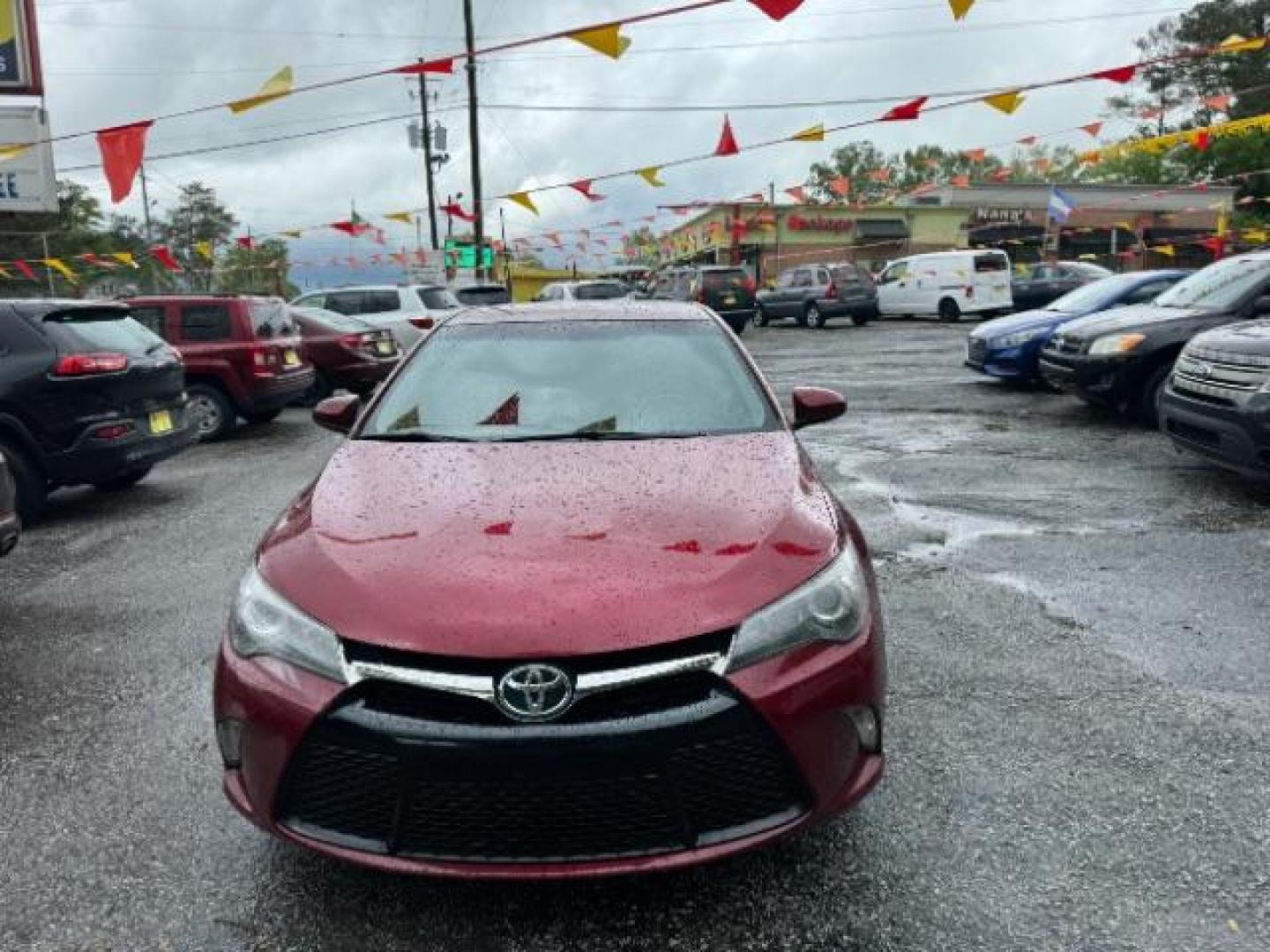 2016 Red Toyota Camry SE (4T1BF1FK4GU) with an 2.5L L4 DOHC 16V engine, 6-Speed Automatic transmission, located at 1806 Veterans Memorial Hwy SW, Austell, GA, 30168, (770) 944-9558, 33.817959, -84.606987 - Photo#1