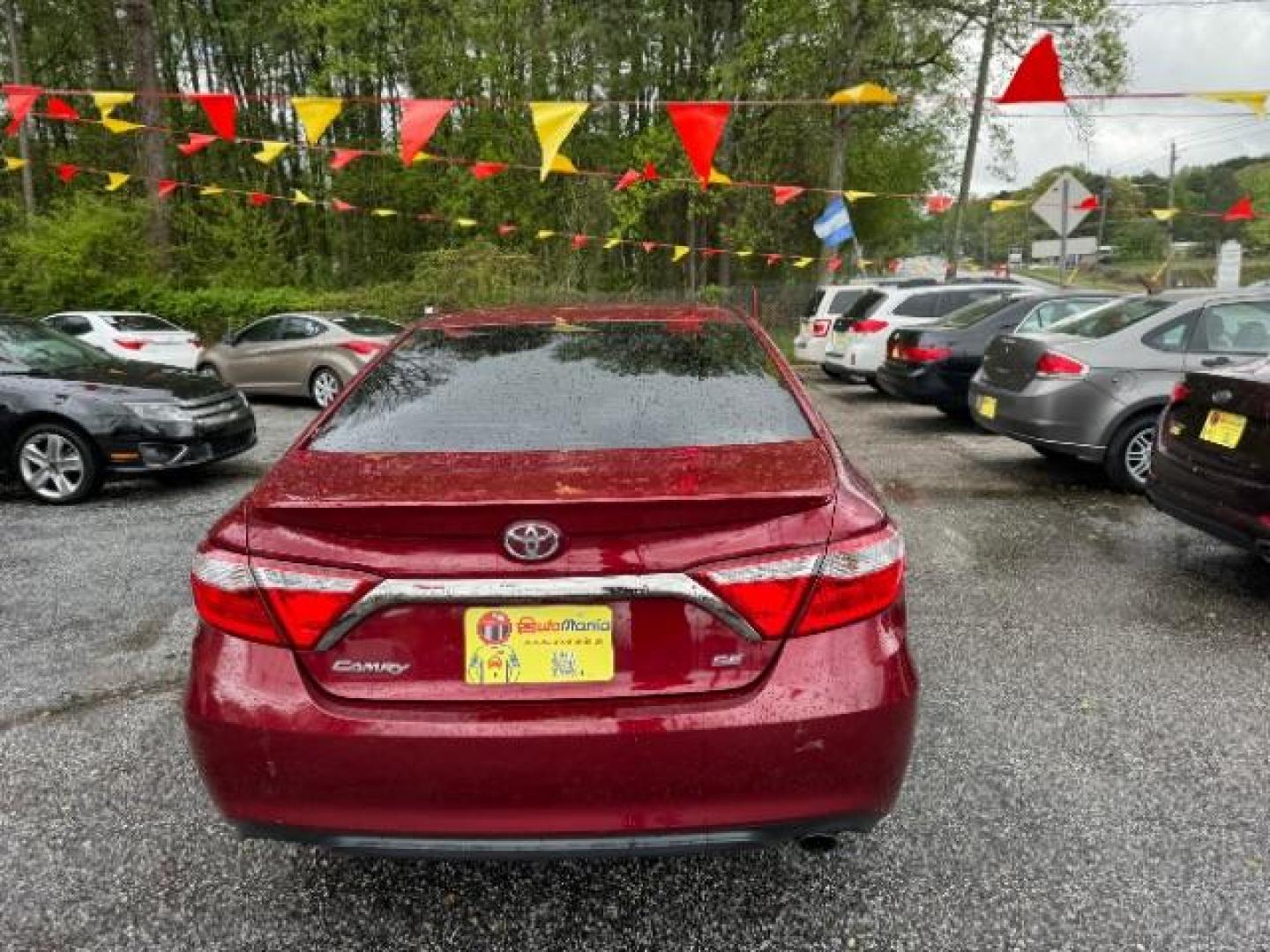 2016 Red Toyota Camry SE (4T1BF1FK4GU) with an 2.5L L4 DOHC 16V engine, 6-Speed Automatic transmission, located at 1806 Veterans Memorial Hwy SW, Austell, GA, 30168, (770) 944-9558, 33.817959, -84.606987 - Photo#4