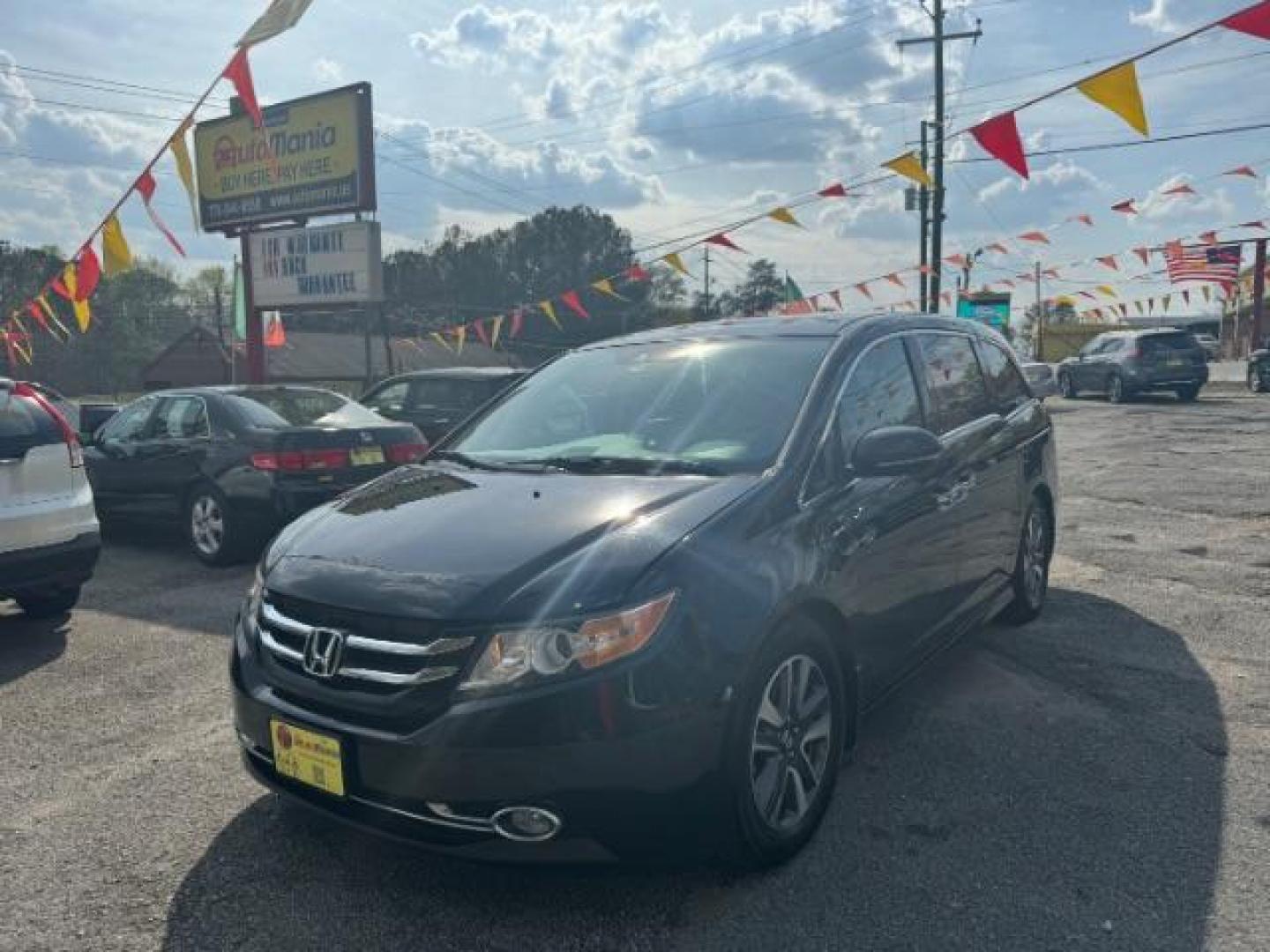 2015 Black Honda Odyssey Touring (5FNRL5H91FB) with an 3.5L V6 SOHC 24V engine, 6-Speed Automatic transmission, located at 1806 Veterans Memorial Hwy SW, Austell, GA, 30168, (770) 944-9558, 33.817959, -84.606987 - Photo#0