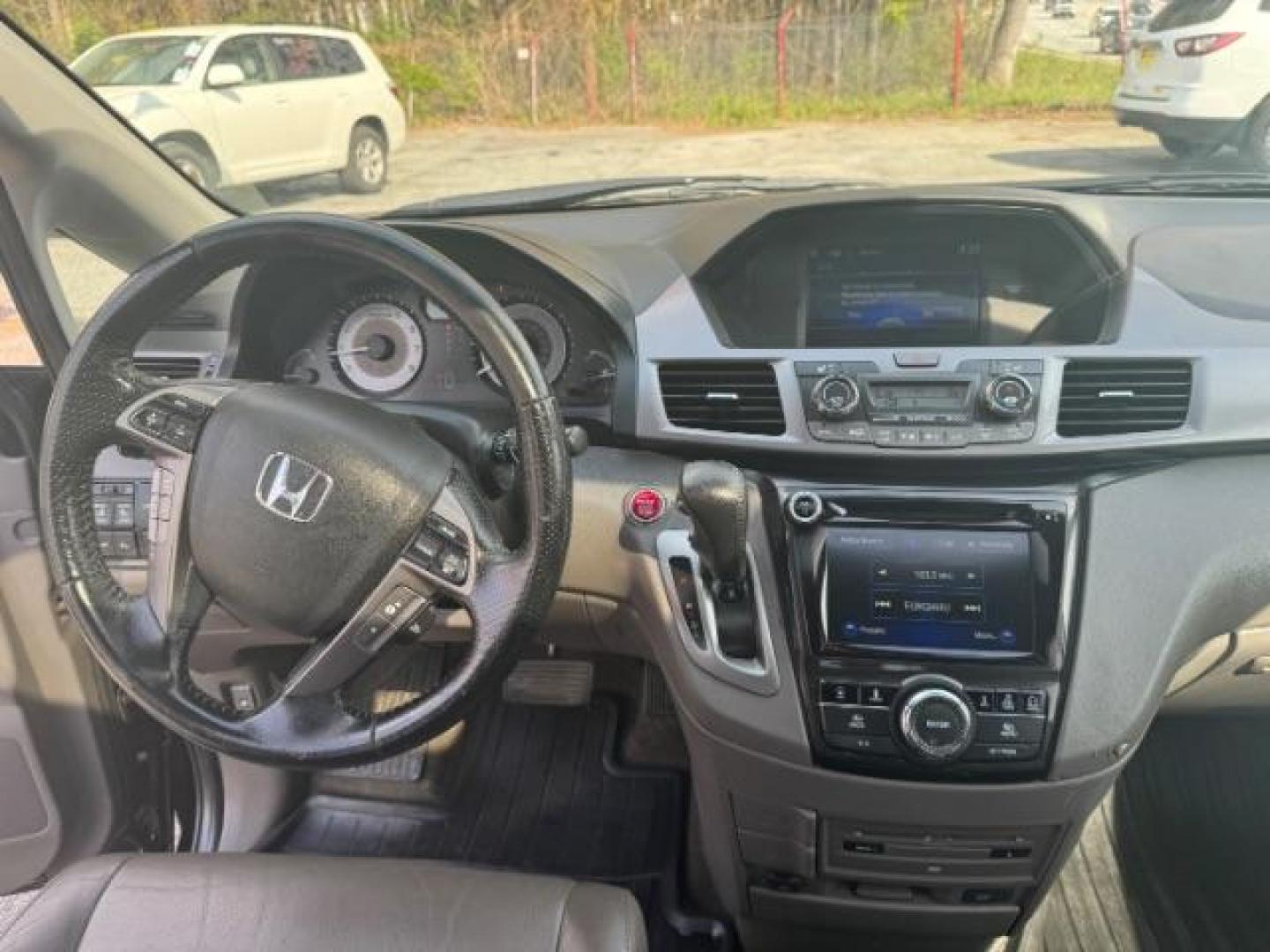 2015 Black Honda Odyssey Touring (5FNRL5H91FB) with an 3.5L V6 SOHC 24V engine, 6-Speed Automatic transmission, located at 1806 Veterans Memorial Hwy SW, Austell, GA, 30168, (770) 944-9558, 33.817959, -84.606987 - Photo#11