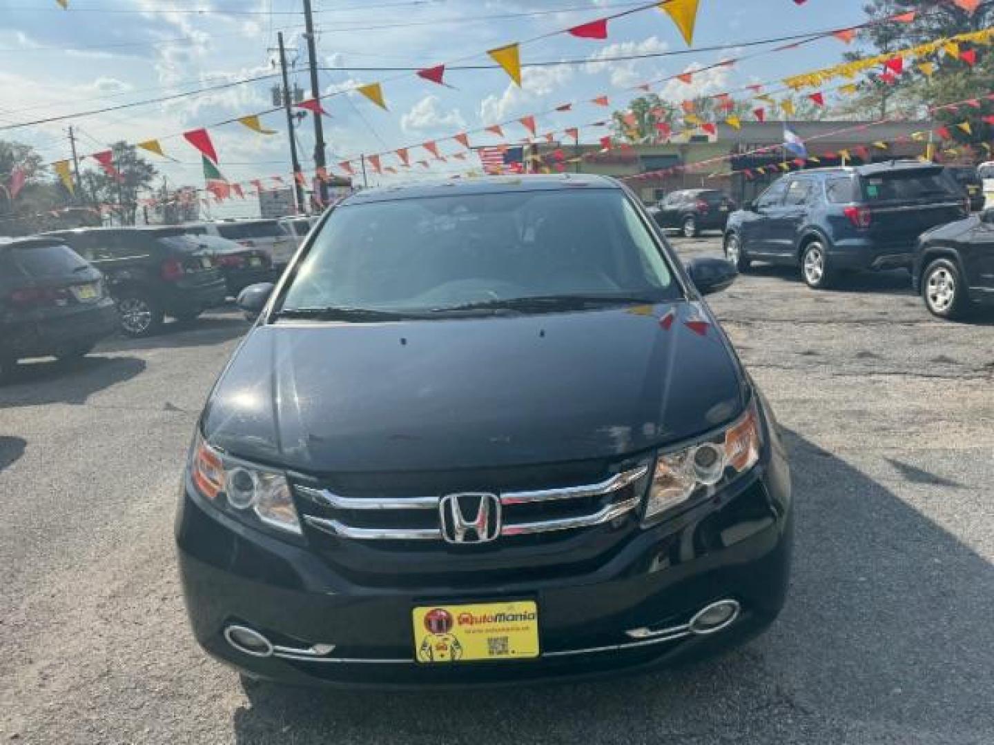 2015 Black Honda Odyssey Touring (5FNRL5H91FB) with an 3.5L V6 SOHC 24V engine, 6-Speed Automatic transmission, located at 1806 Veterans Memorial Hwy SW, Austell, GA, 30168, (770) 944-9558, 33.817959, -84.606987 - Photo#1