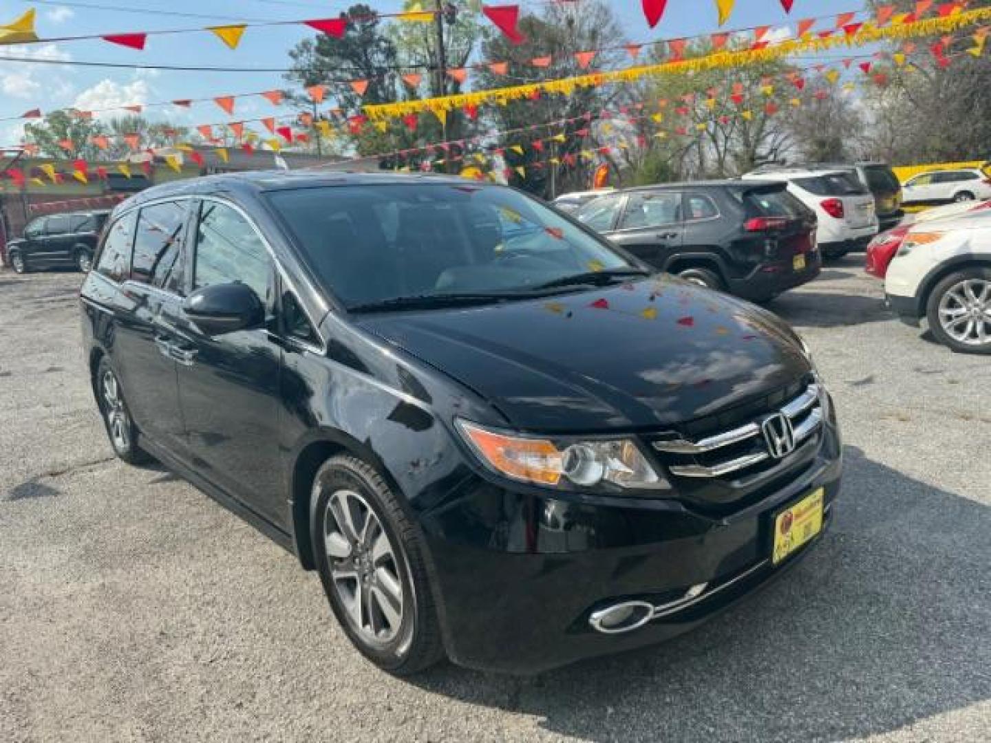 2015 Black Honda Odyssey Touring (5FNRL5H91FB) with an 3.5L V6 SOHC 24V engine, 6-Speed Automatic transmission, located at 1806 Veterans Memorial Hwy SW, Austell, GA, 30168, (770) 944-9558, 33.817959, -84.606987 - Photo#2