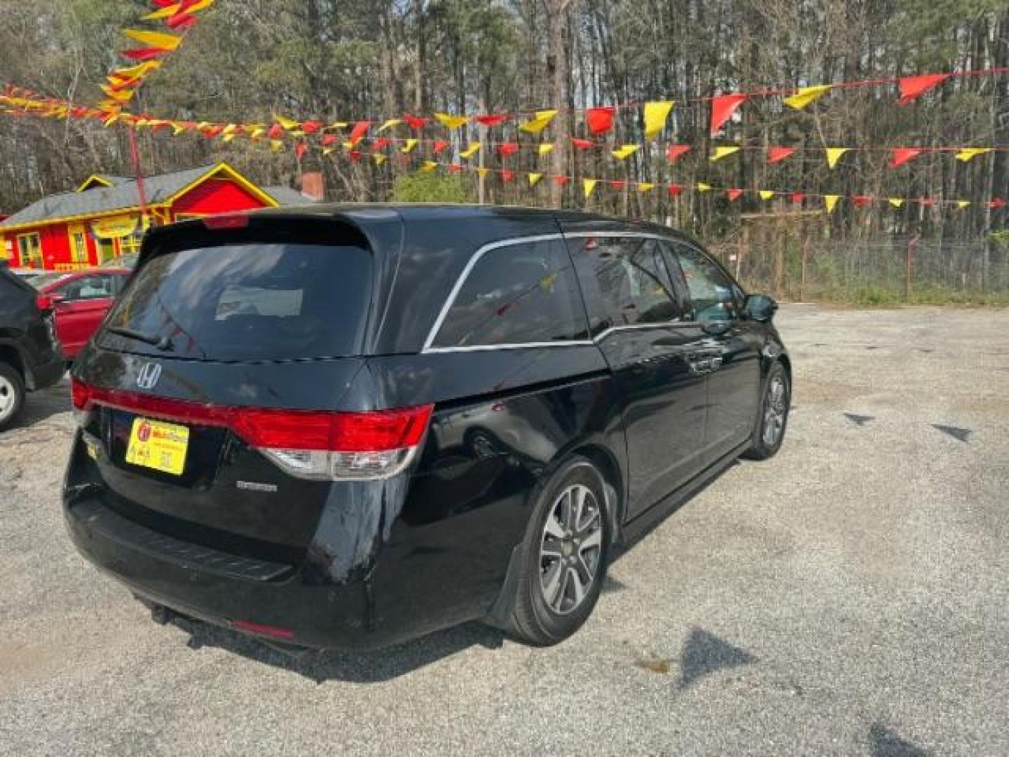 2015 Black Honda Odyssey Touring (5FNRL5H91FB) with an 3.5L V6 SOHC 24V engine, 6-Speed Automatic transmission, located at 1806 Veterans Memorial Hwy SW, Austell, GA, 30168, (770) 944-9558, 33.817959, -84.606987 - Photo#3