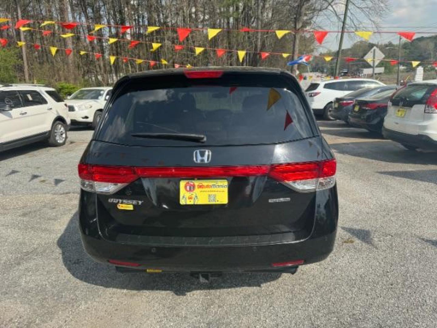 2015 Black Honda Odyssey Touring (5FNRL5H91FB) with an 3.5L V6 SOHC 24V engine, 6-Speed Automatic transmission, located at 1806 Veterans Memorial Hwy SW, Austell, GA, 30168, (770) 944-9558, 33.817959, -84.606987 - Photo#4