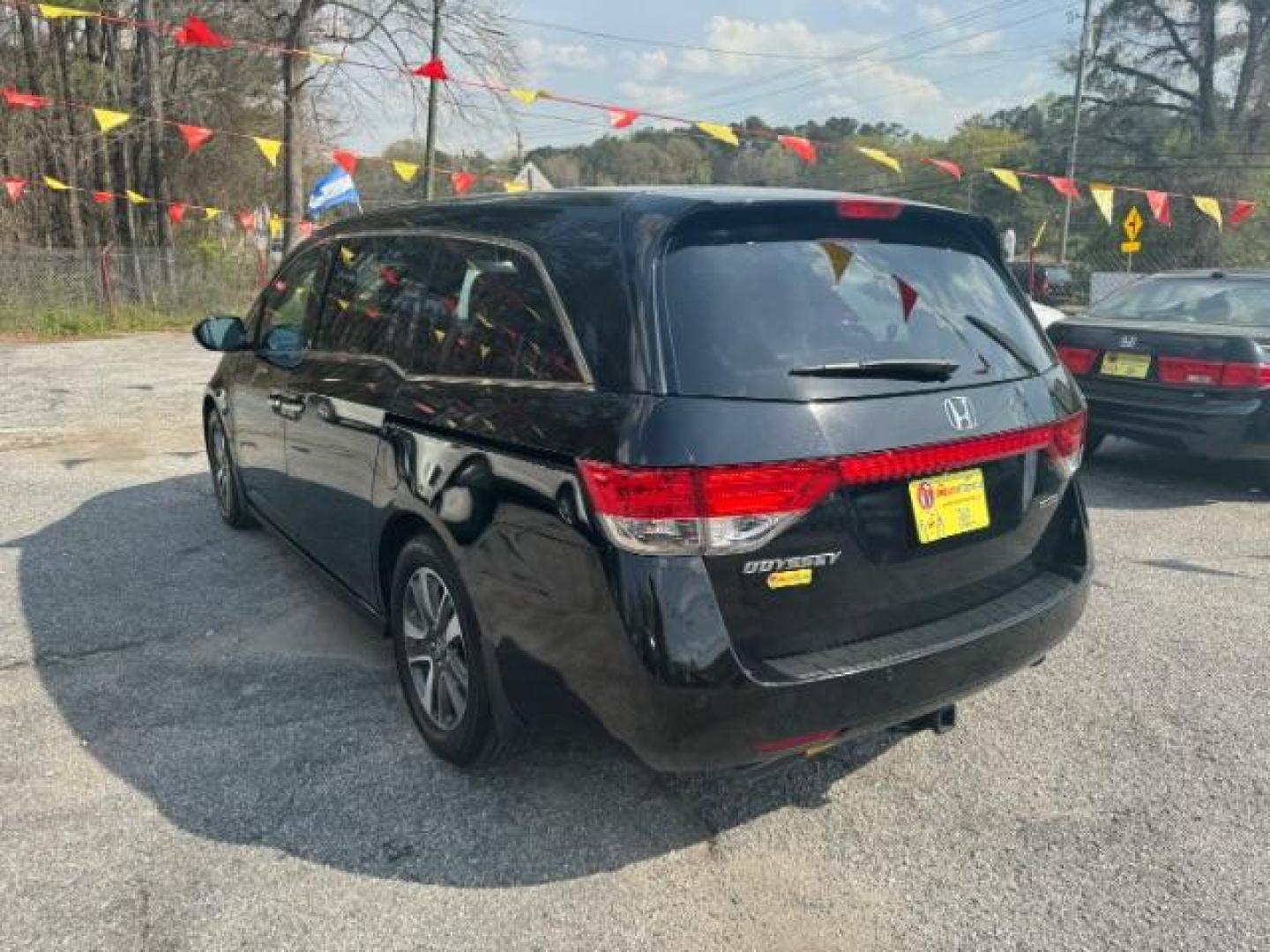 2015 Black Honda Odyssey Touring (5FNRL5H91FB) with an 3.5L V6 SOHC 24V engine, 6-Speed Automatic transmission, located at 1806 Veterans Memorial Hwy SW, Austell, GA, 30168, (770) 944-9558, 33.817959, -84.606987 - Photo#5