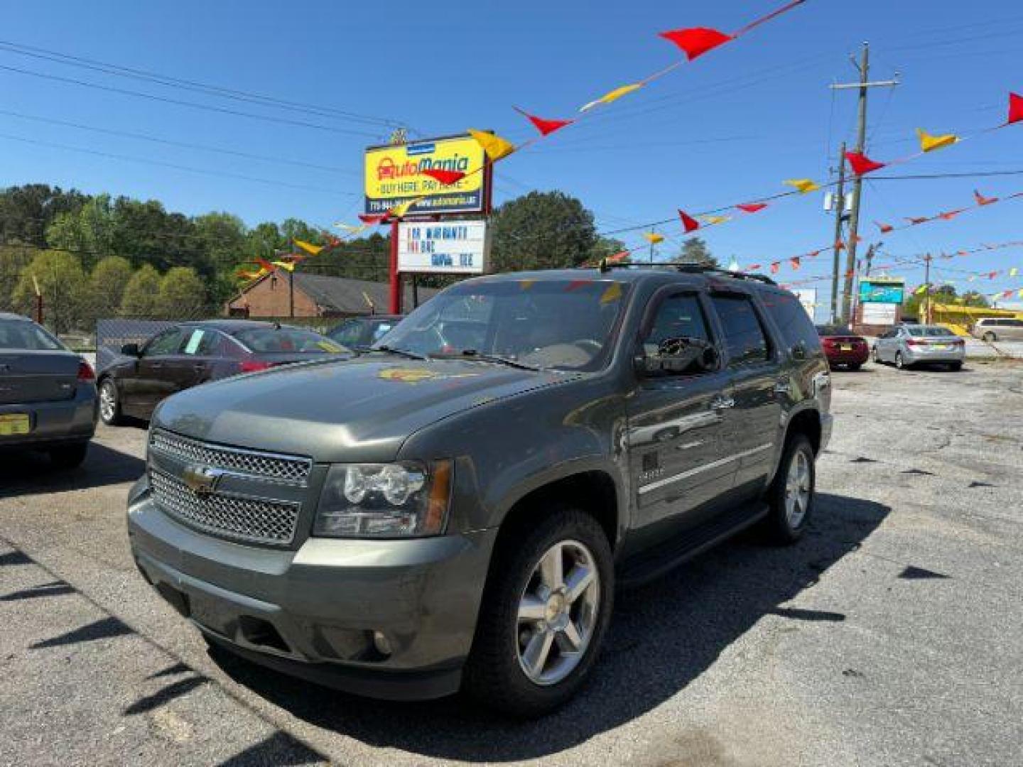 2011 Green Chevrolet Tahoe LTZ 2WD (1GNSCCE05BR) with an 5.3L V8 OHV 16V FFV engine, 6-Speed Automatic transmission, located at 1806 Veterans Memorial Hwy SW, Austell, GA, 30168, (770) 944-9558, 33.817959, -84.606987 - Photo#0