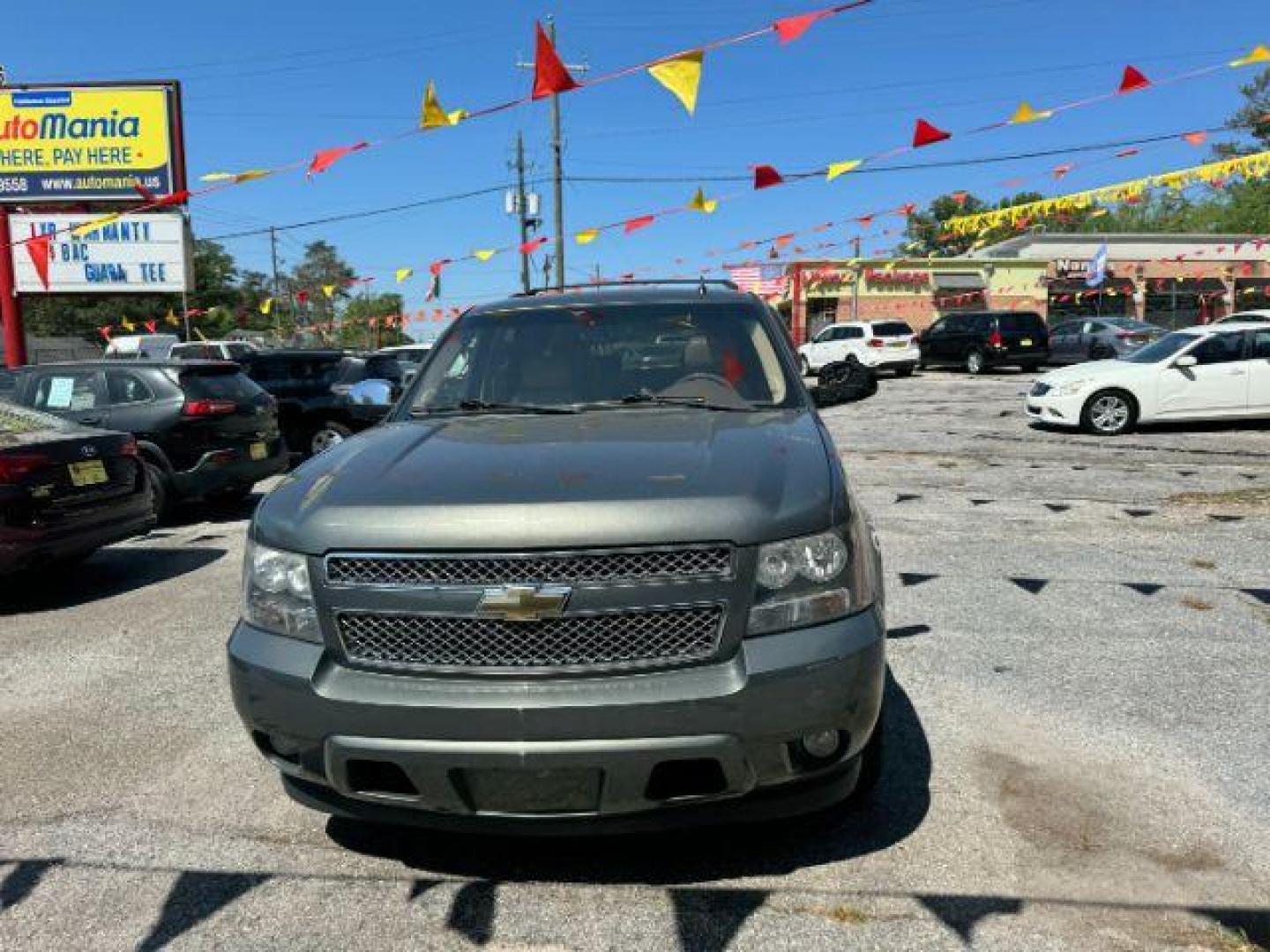 2011 Green Chevrolet Tahoe LTZ 2WD (1GNSCCE05BR) with an 5.3L V8 OHV 16V FFV engine, 6-Speed Automatic transmission, located at 1806 Veterans Memorial Hwy SW, Austell, GA, 30168, (770) 944-9558, 33.817959, -84.606987 - Photo#1