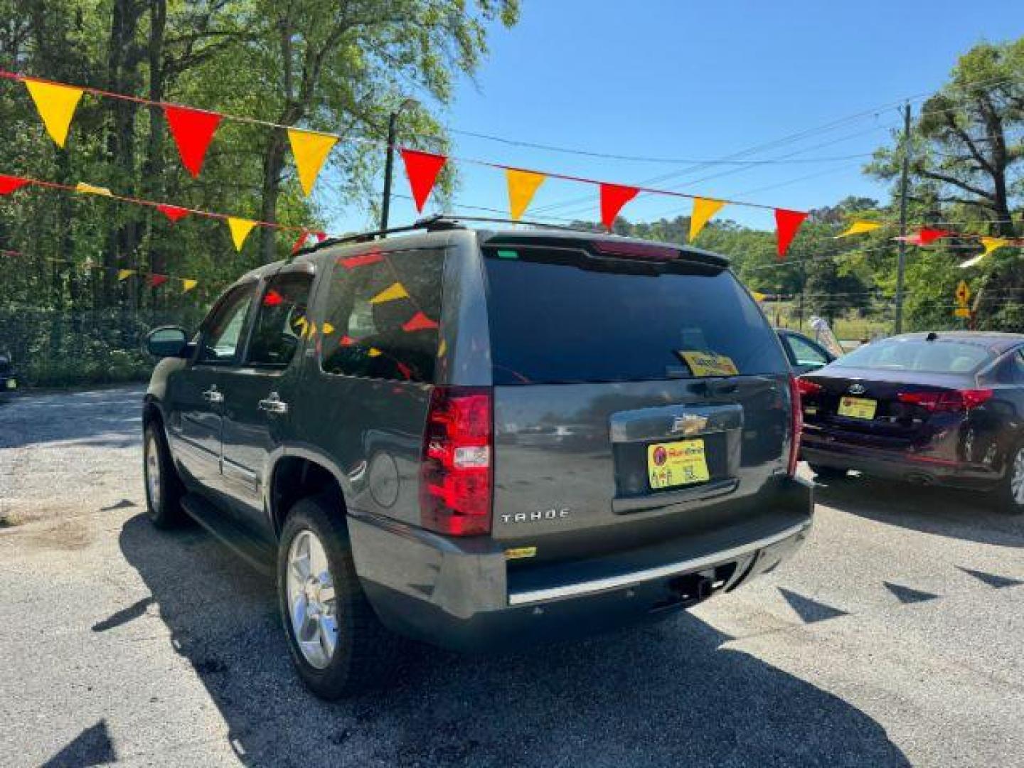 2011 Green Chevrolet Tahoe LTZ 2WD (1GNSCCE05BR) with an 5.3L V8 OHV 16V FFV engine, 6-Speed Automatic transmission, located at 1806 Veterans Memorial Hwy SW, Austell, GA, 30168, (770) 944-9558, 33.817959, -84.606987 - Photo#5